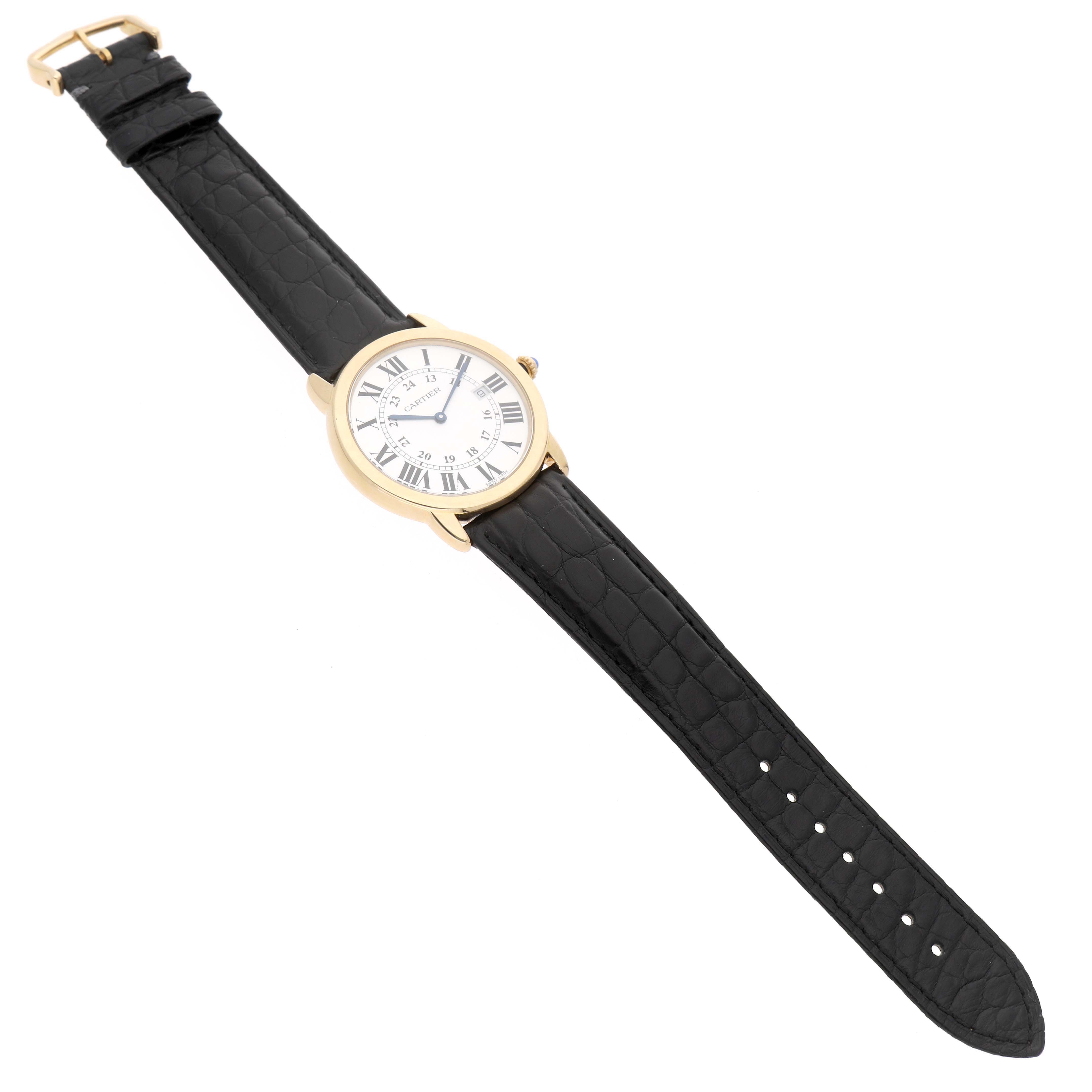 The Cartier Ronde W6700455 Men's Yellow Gold Silver Dial watch is shown from a top view, displaying its black leather strap and round gold case with Roman numerals.