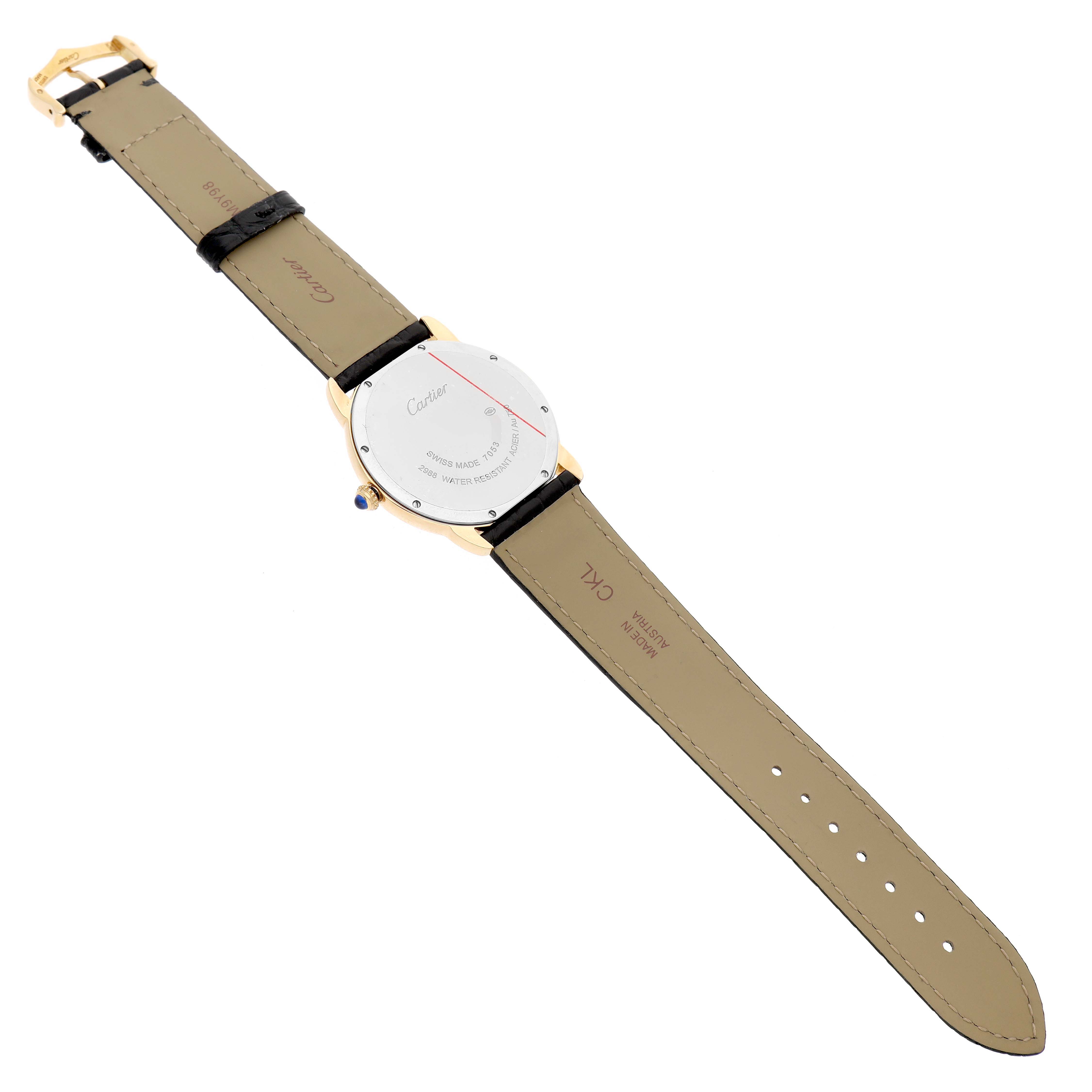 The Cartier Ronde W6700455 Men's Yellow Gold Silver Dial watch is shown from the back, highlighting the leather strap, case back, and crown.