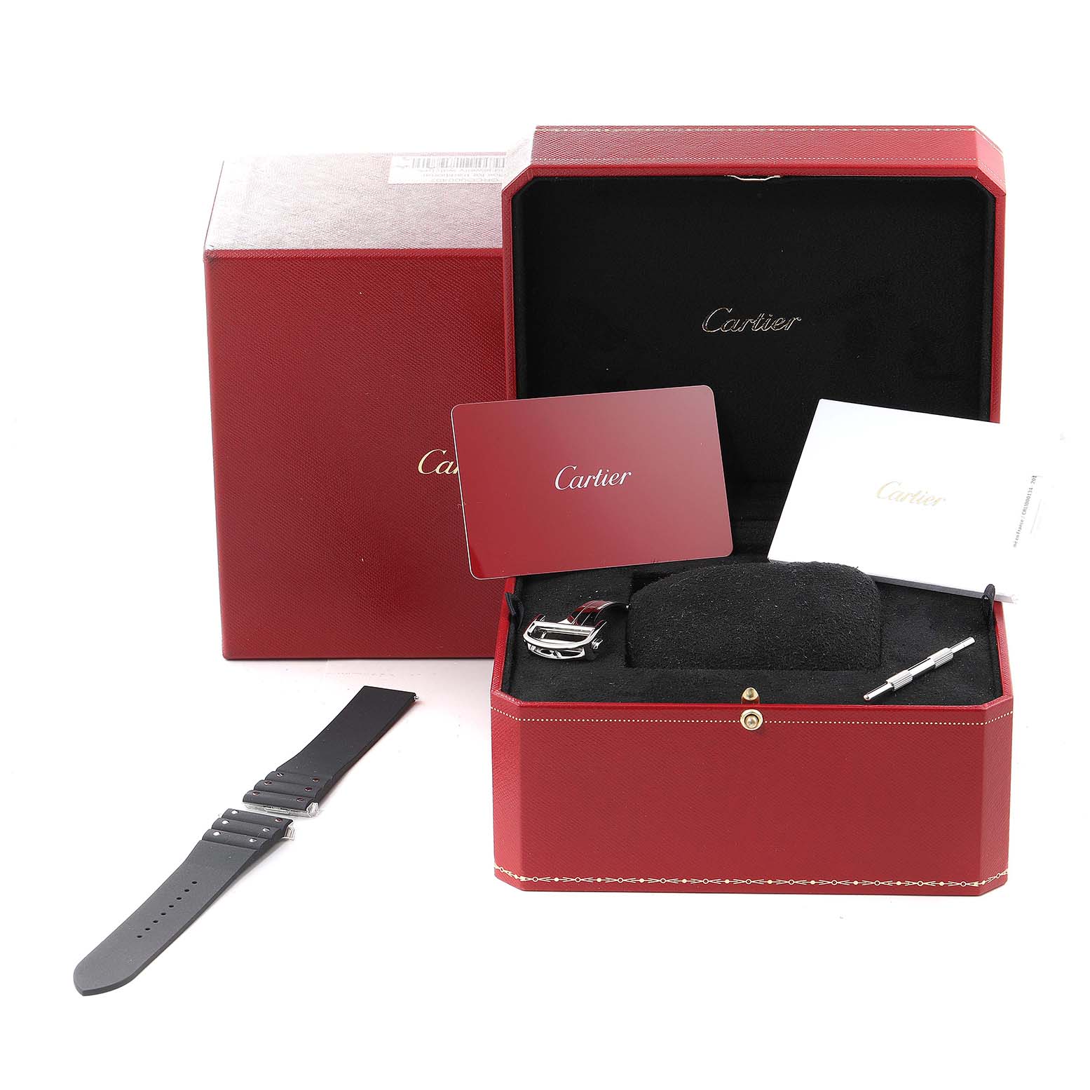 The image shows the Cartier Santos WSSA0037 Men's Stainless Steel Grey Dial WSSA0037 Men's Stainless Steel Grey Dial model box, including a spare strap, buckle, manuals, and a tool, viewed from the front.