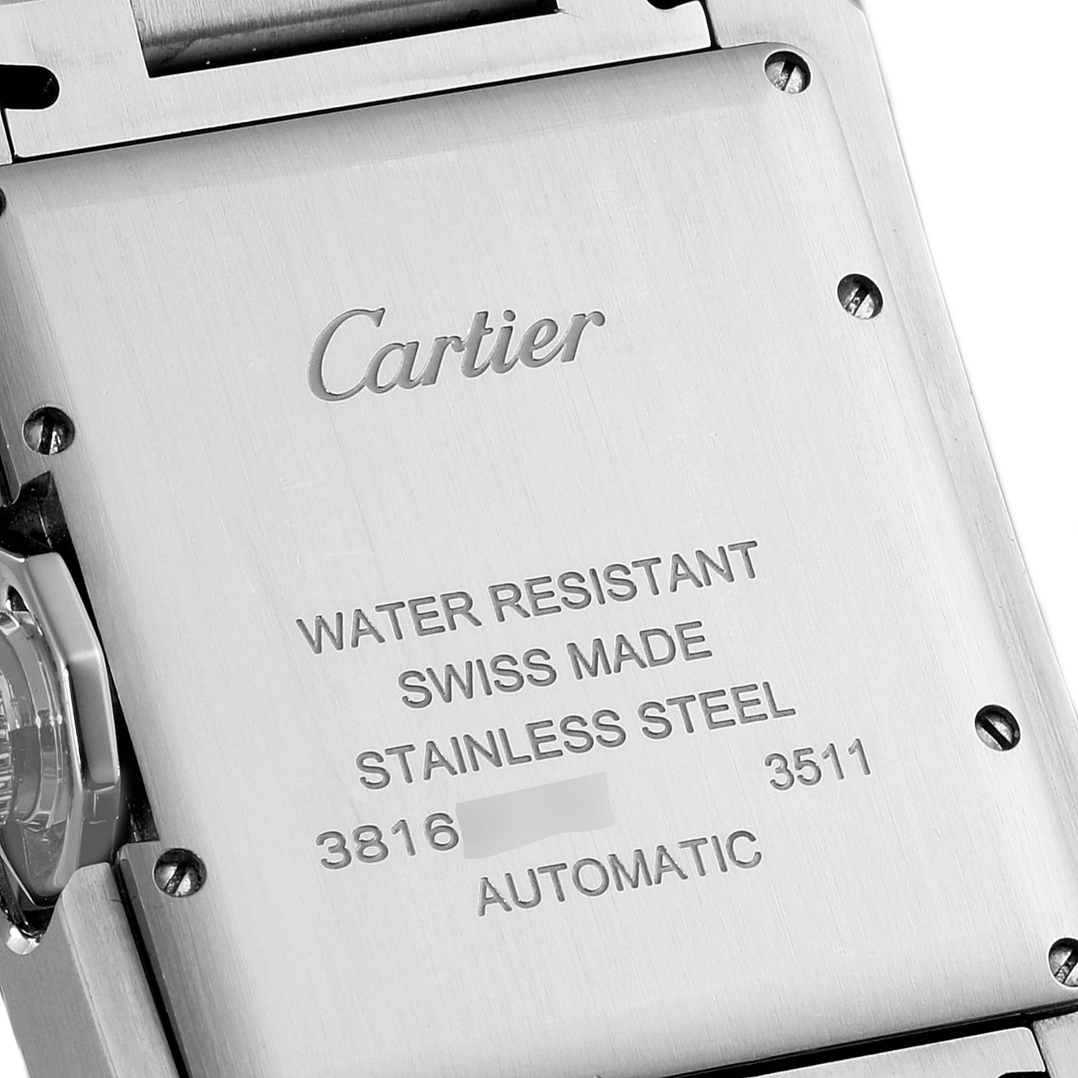 The image shows the back case of a Cartier Tank Anglaise W5310009 Men
s Stainless Steel Silver Dial W5310009 Men
s Stainless Steel Silver Dial watch, highlighting engravings and screws in stainless steel.