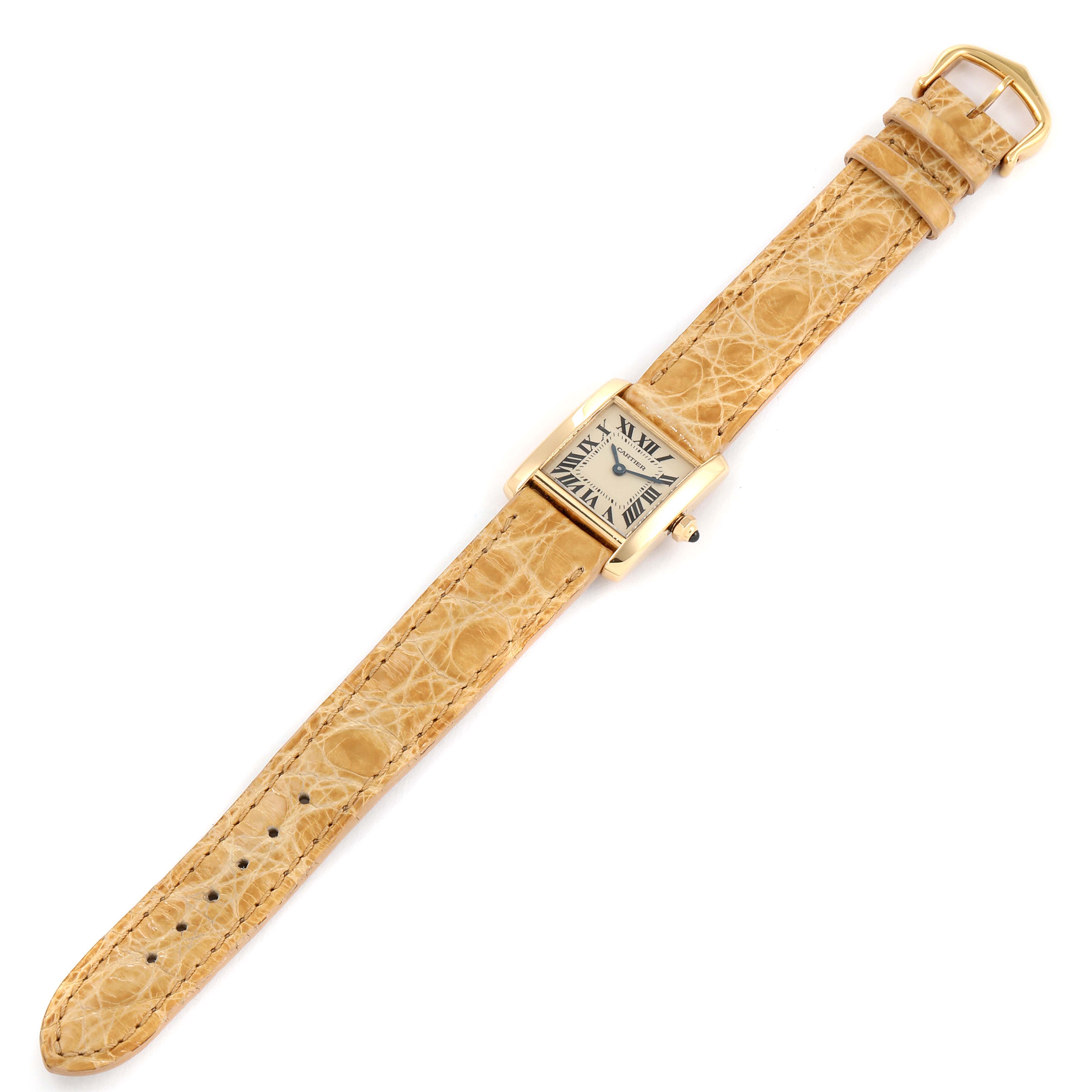 The Cartier Tank Francaise W5000256 Women
s Yellow Gold Silver Dial W5000256 Women
s Yellow Gold Silver Dial watch is shown from a top-down angle, displaying its face, bezel, and beige leather strap.