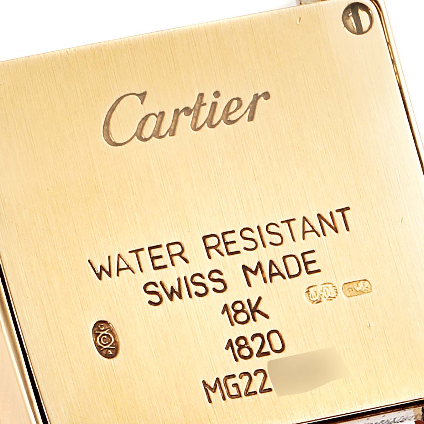 This image shows the case back of the Cartier Tank Francaise W5000256 Women
s Yellow Gold Silver Dial W5000256 Women
s Yellow Gold Silver Dial watch, highlighting the engraving details.