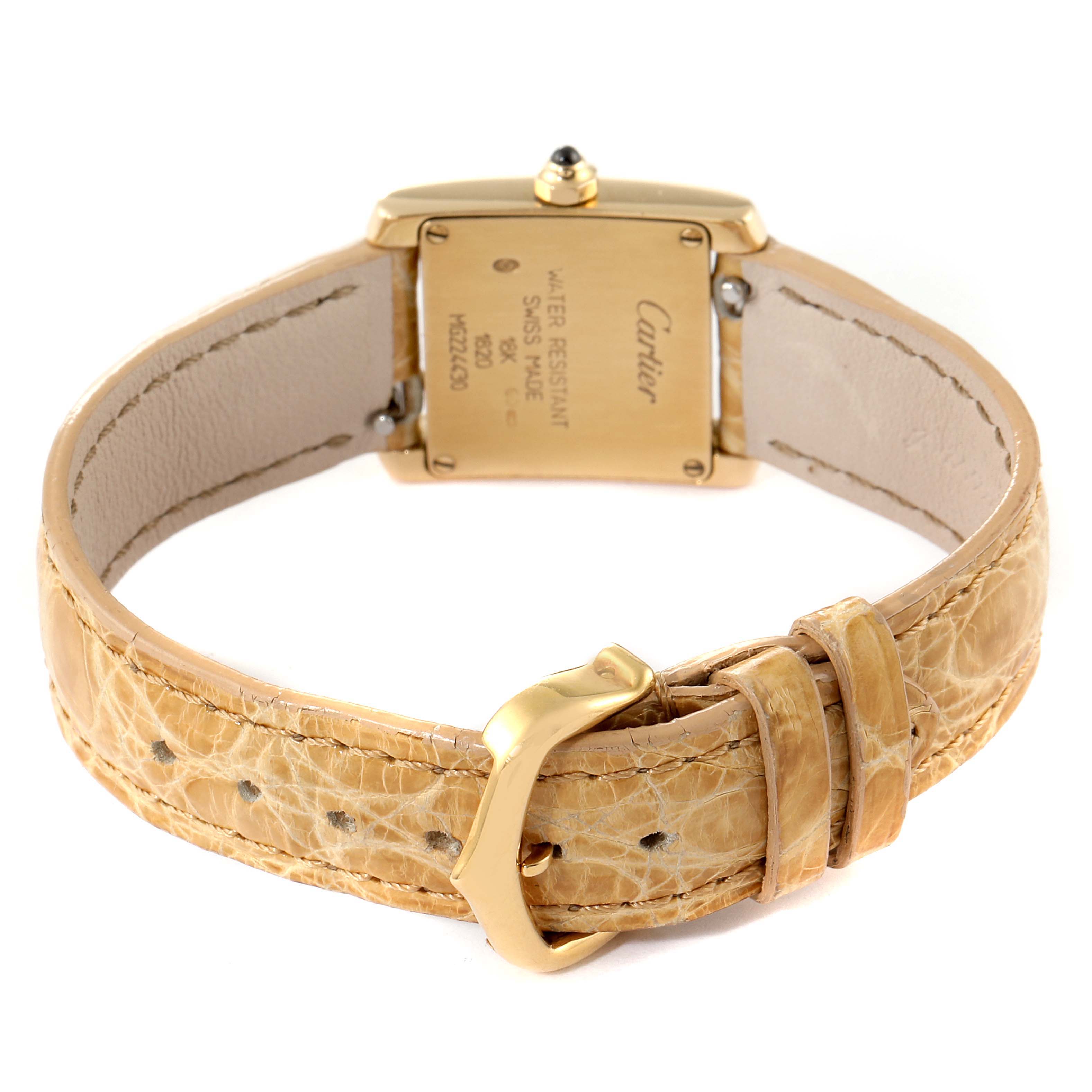 The image shows the back view of a Cartier Tank Francaise W5000256 Women
s Yellow Gold Silver Dial W5000256 Women
s Yellow Gold Silver Dial watch with a focus on the caseback and leather strap.