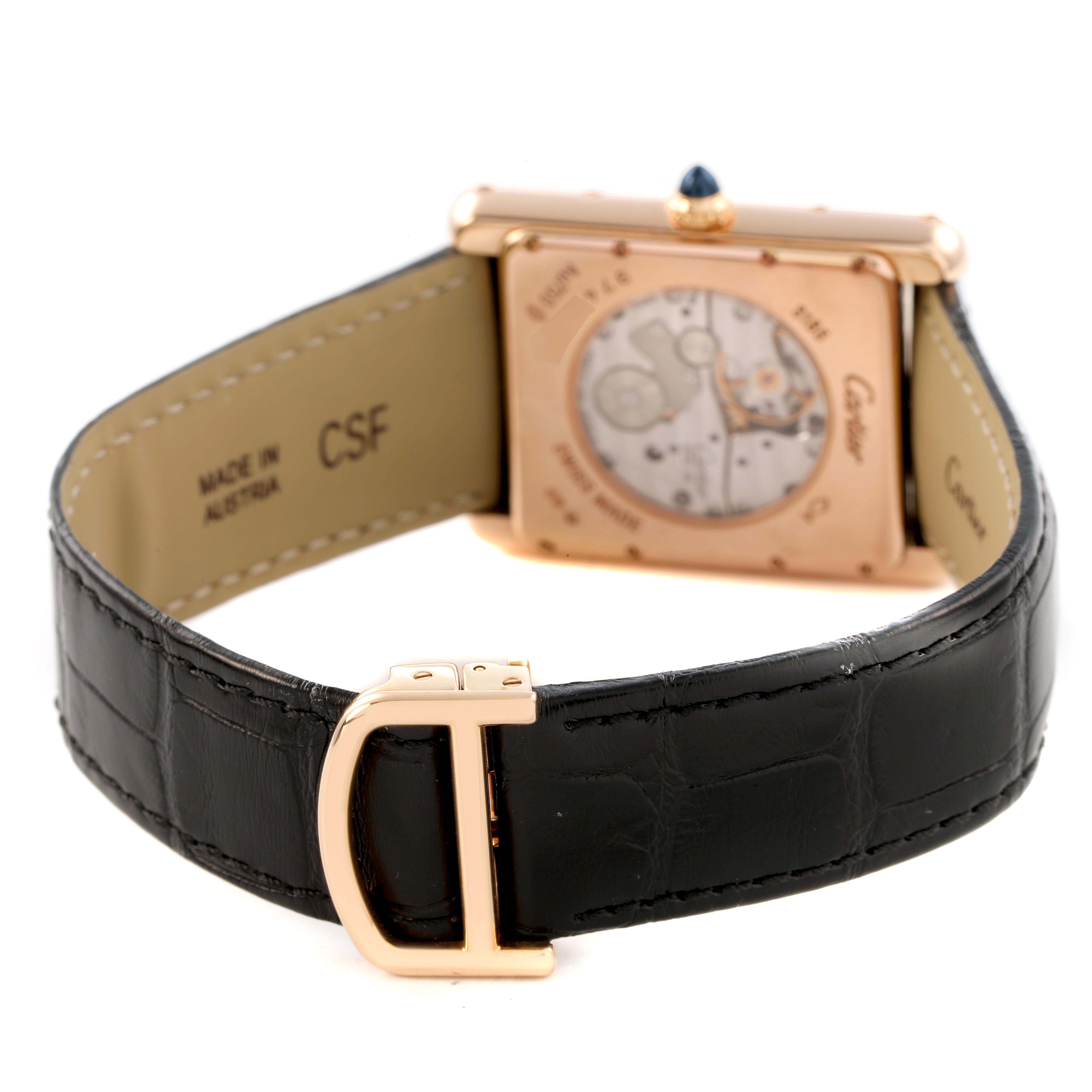 The image shows the back of a Cartier Tank Louis W1560002 Men's Rose Gold Brown Dial watch, displaying the movement and part of the leather strap with a buckle.