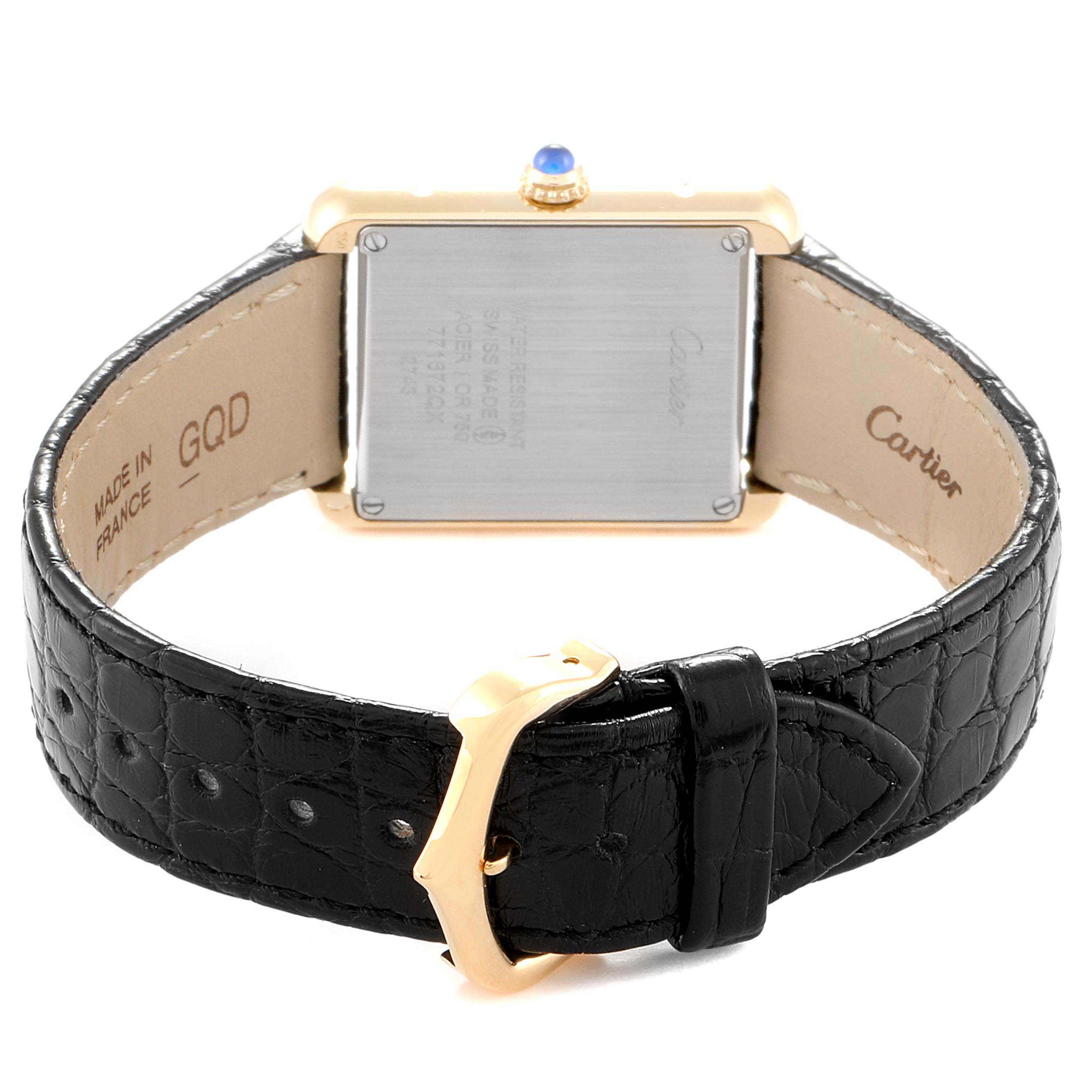 The image shows the Cartier Tank Solo W1018755 Women
s Yellow Gold Silver Dial W1018755 Women
s Yellow Gold Silver Dial watch from the back, highlighting the case back, strap, and buckle.