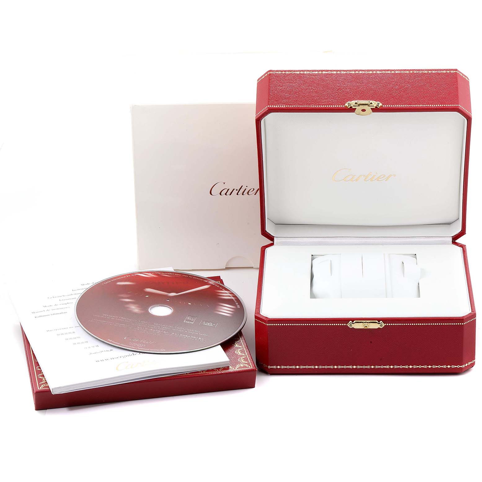 The image shows the packaging, manual, and CD for the Cartier Tank Solo W1018755 Women
s Yellow Gold Silver Dial W1018755 Women
s Yellow Gold Silver Dial watch, including an open red presentation box.