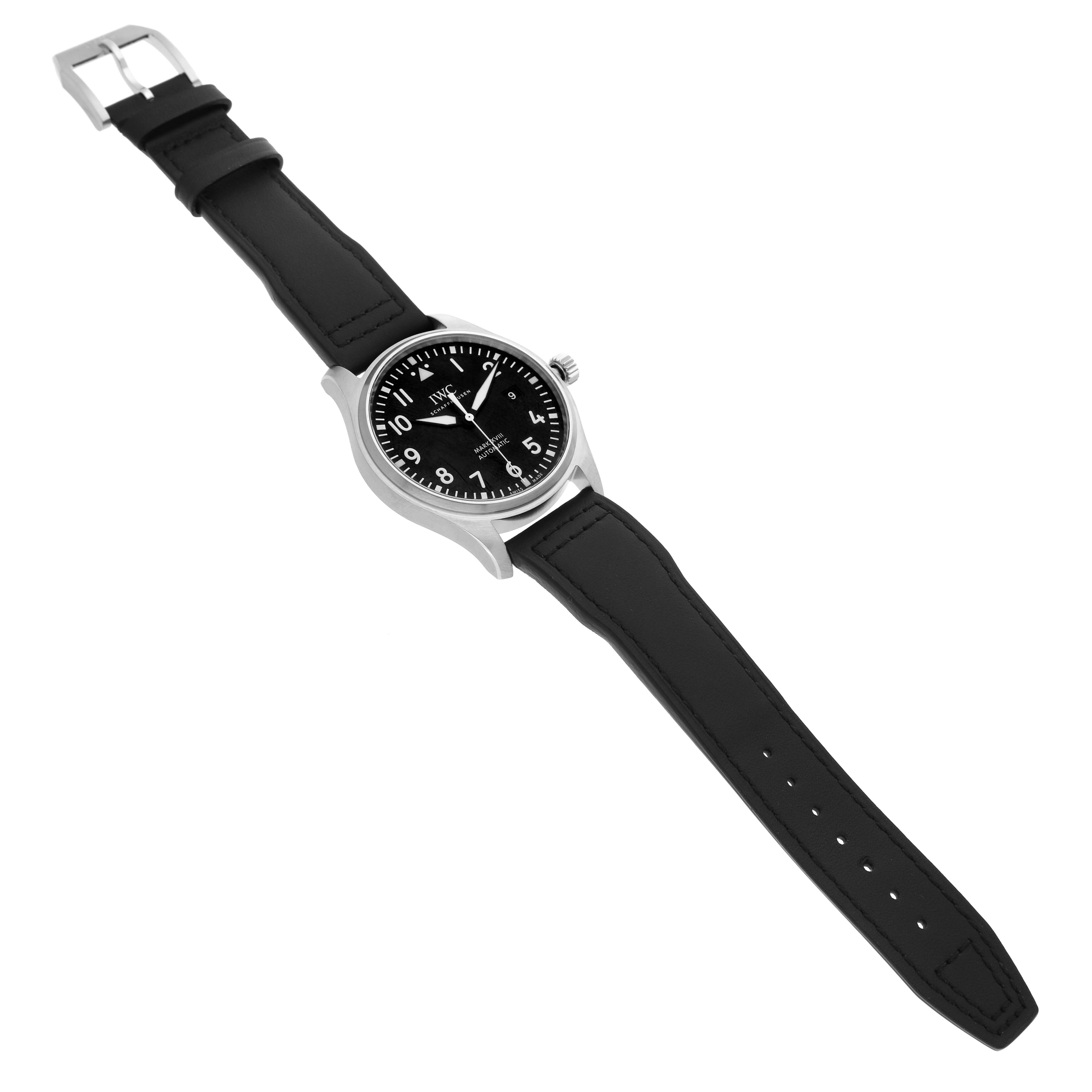 The IWC Pilot IW327001 Men's Stainless Steel Black Dial model watch is shown from a top-down angle, displaying the face, crown, and black leather strap.