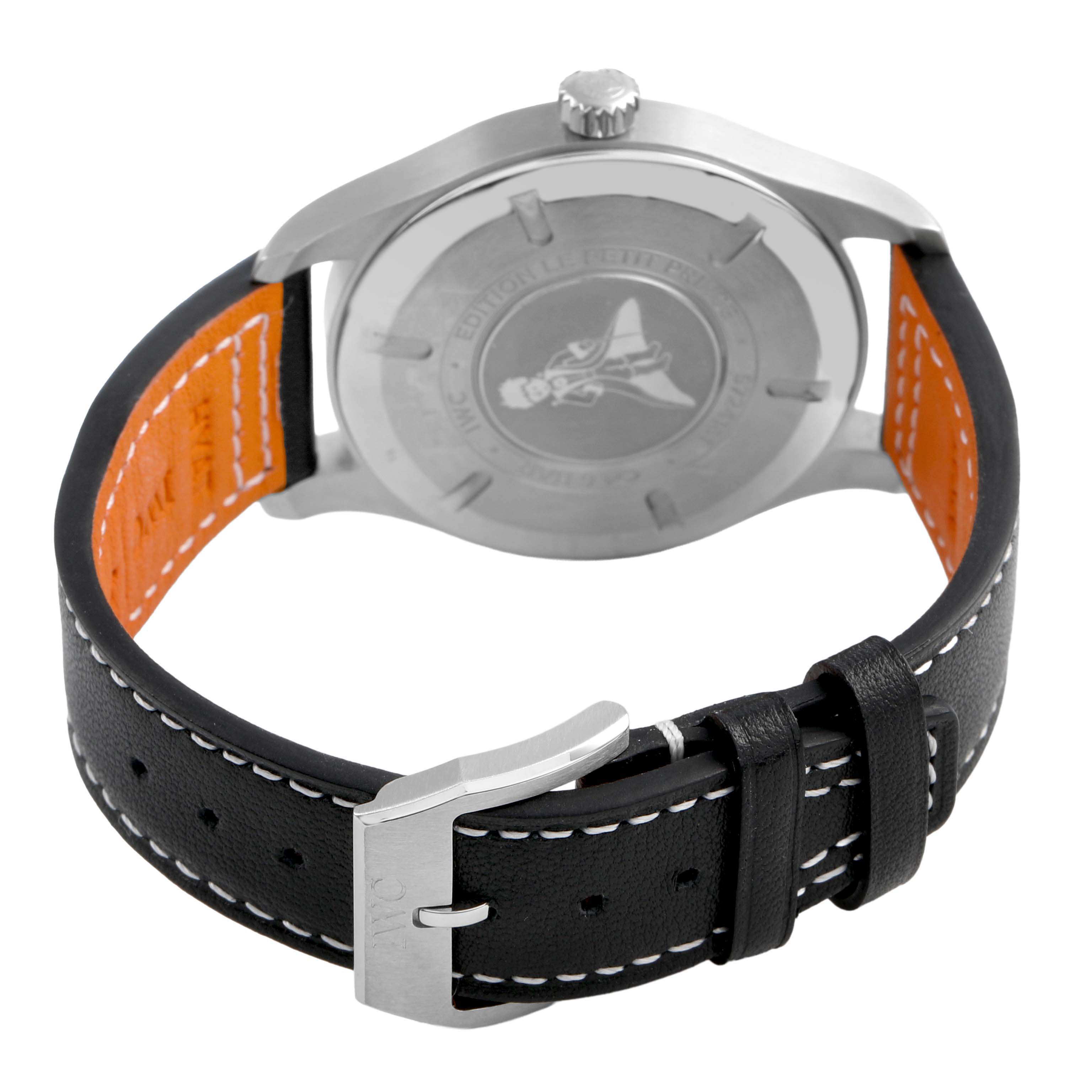 The image shows the back of the IWC Pilot IW327010 Men's Stainless Steel Blue Dial watch, displaying the case back and black leather strap with stitching and buckle.