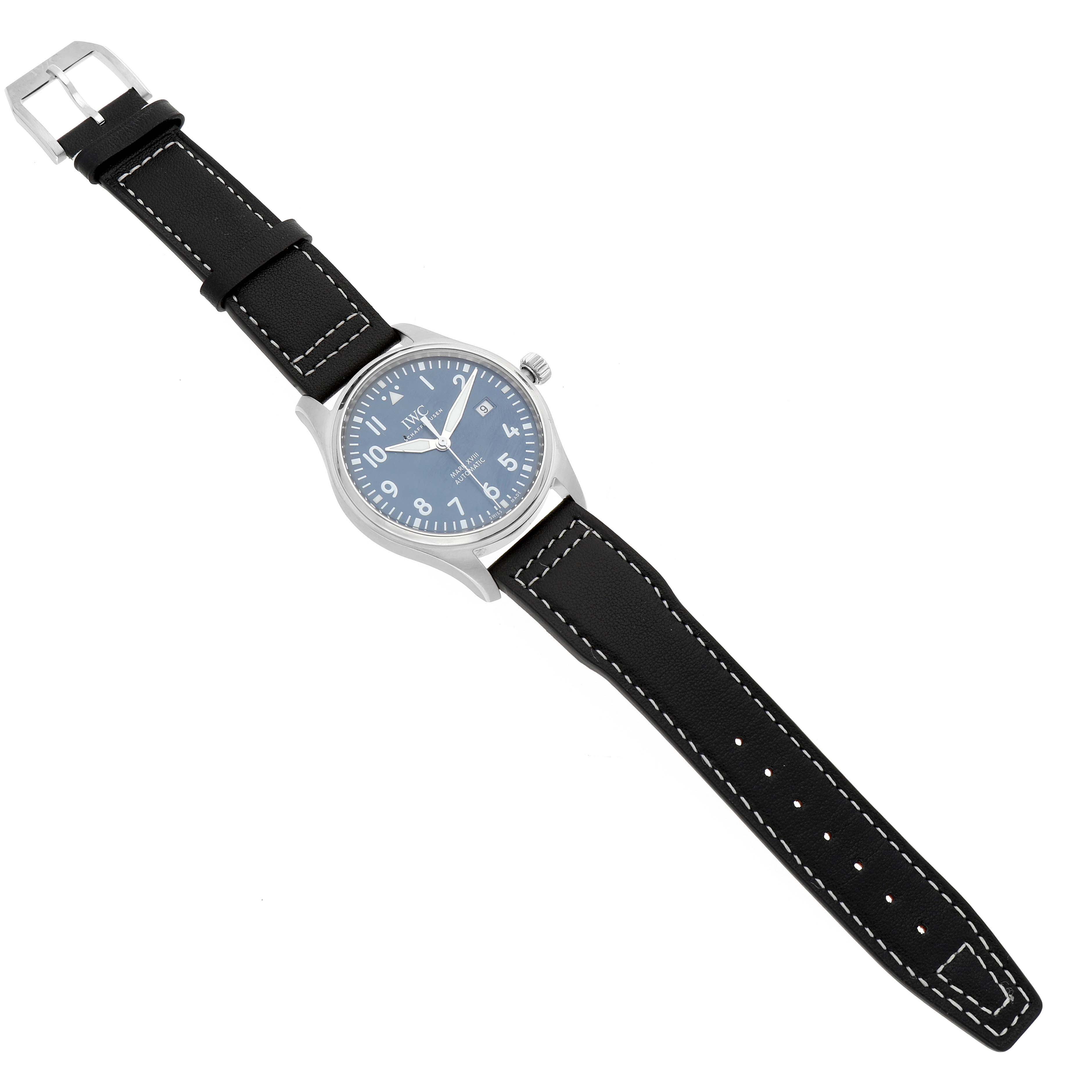 The IWC Pilot IW327010 Men's Stainless Steel Blue Dial watch is shown from a top-down angle, displaying the face, hands, and leather strap with white stitching.