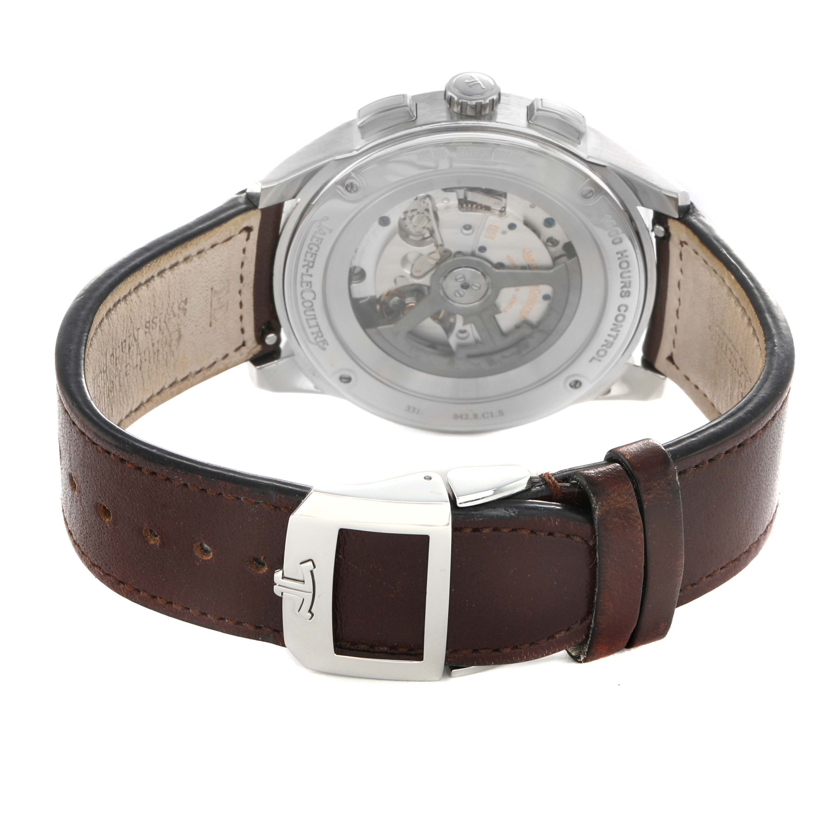The Jaeger LeCoultre Polaris Q9028480 Men's Stainless Steel Blue Dial watch is shown from the back, highlighting the transparent case back and brown leather strap.