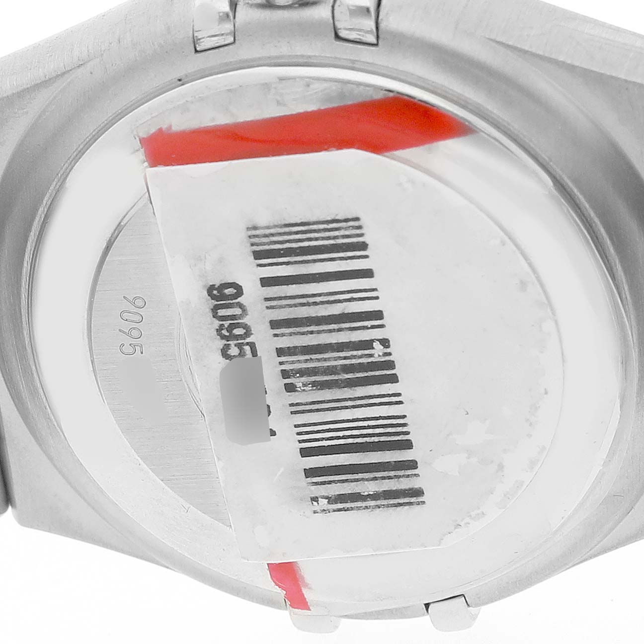 The image shows the back of the Omega 1499.79.00 Women's Stainless Steel Mother of Pearl Dial Constellation Steel Multi Stone MOP Diamond 1499.79.00 watch with a barcode sticker.