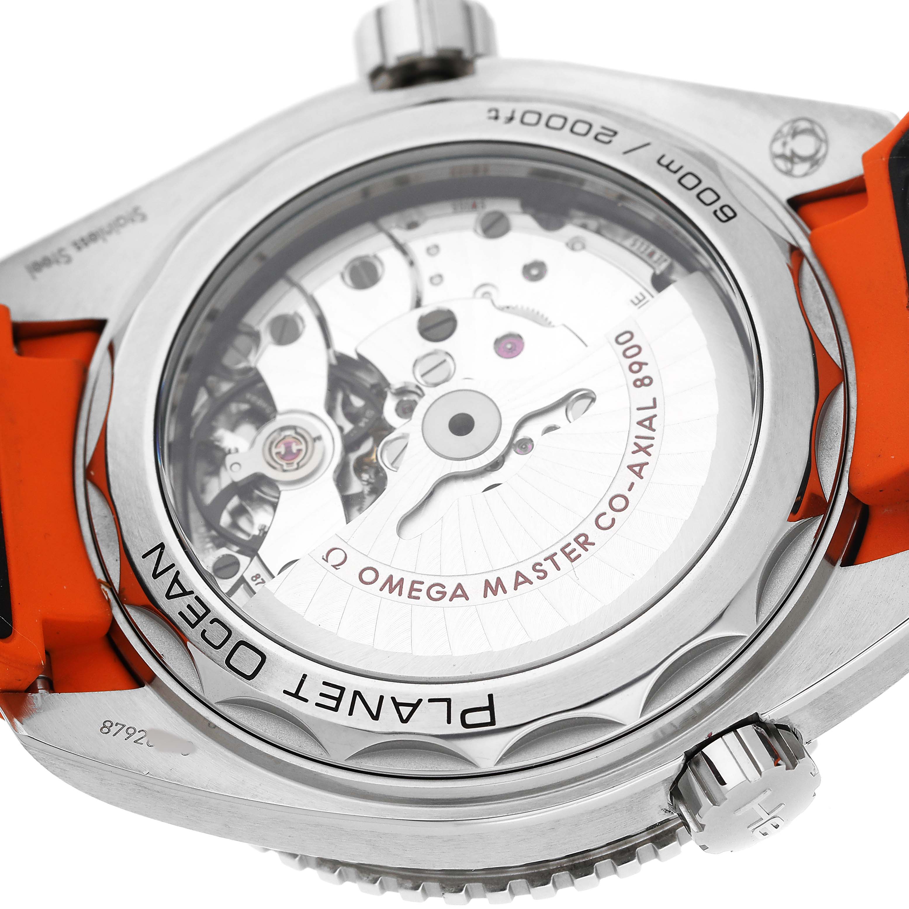The Omega Planet Ocean 215.32.44.21.01.001 Men's Stainless Steel Black Dial watch is shown from the back, highlighting the transparent case back and internal mechanics.