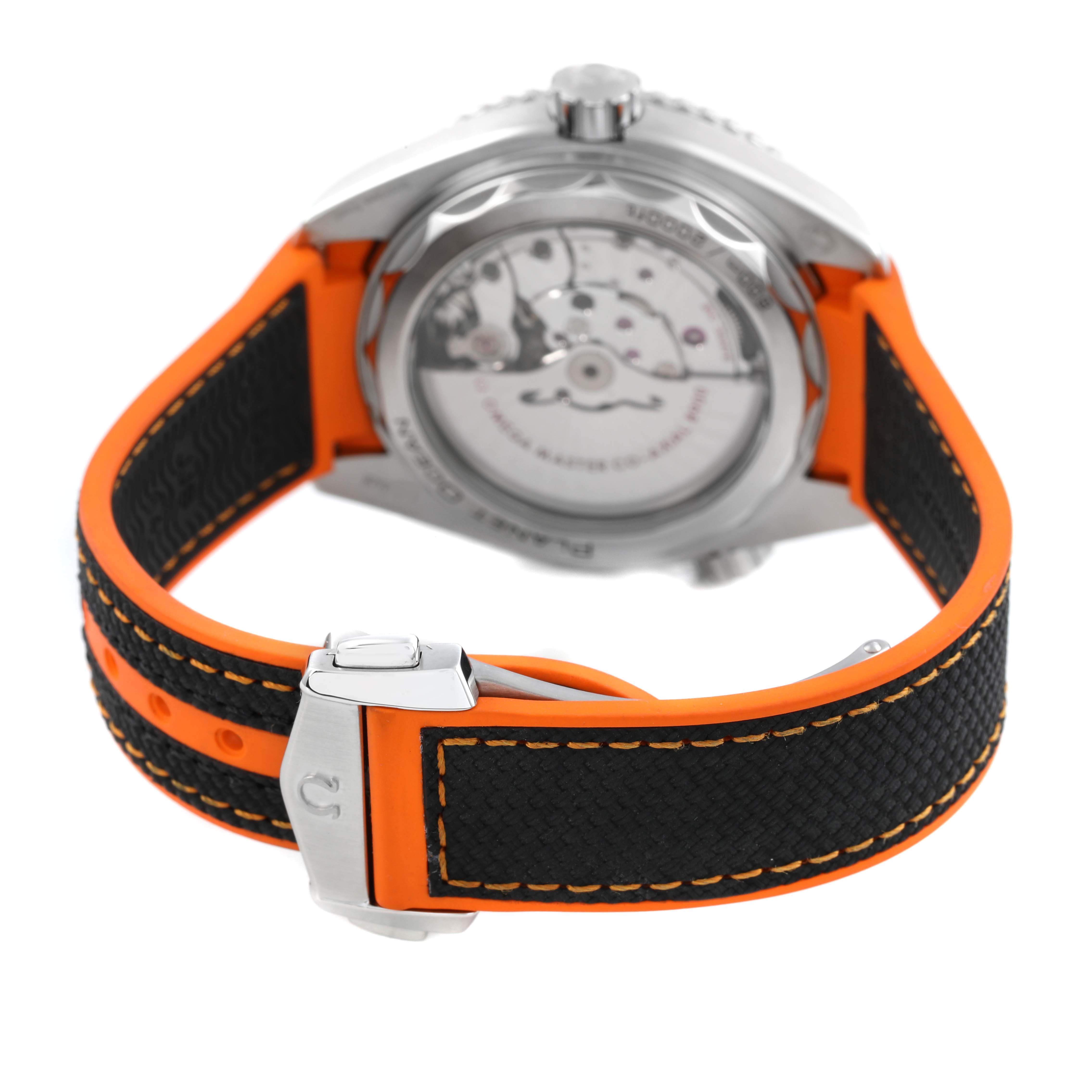 The Omega Planet Ocean 215.32.44.21.01.001 Men's Stainless Steel Black Dial watch is shown from the rear, highlighting the case back and the orange and black strap with clasp.