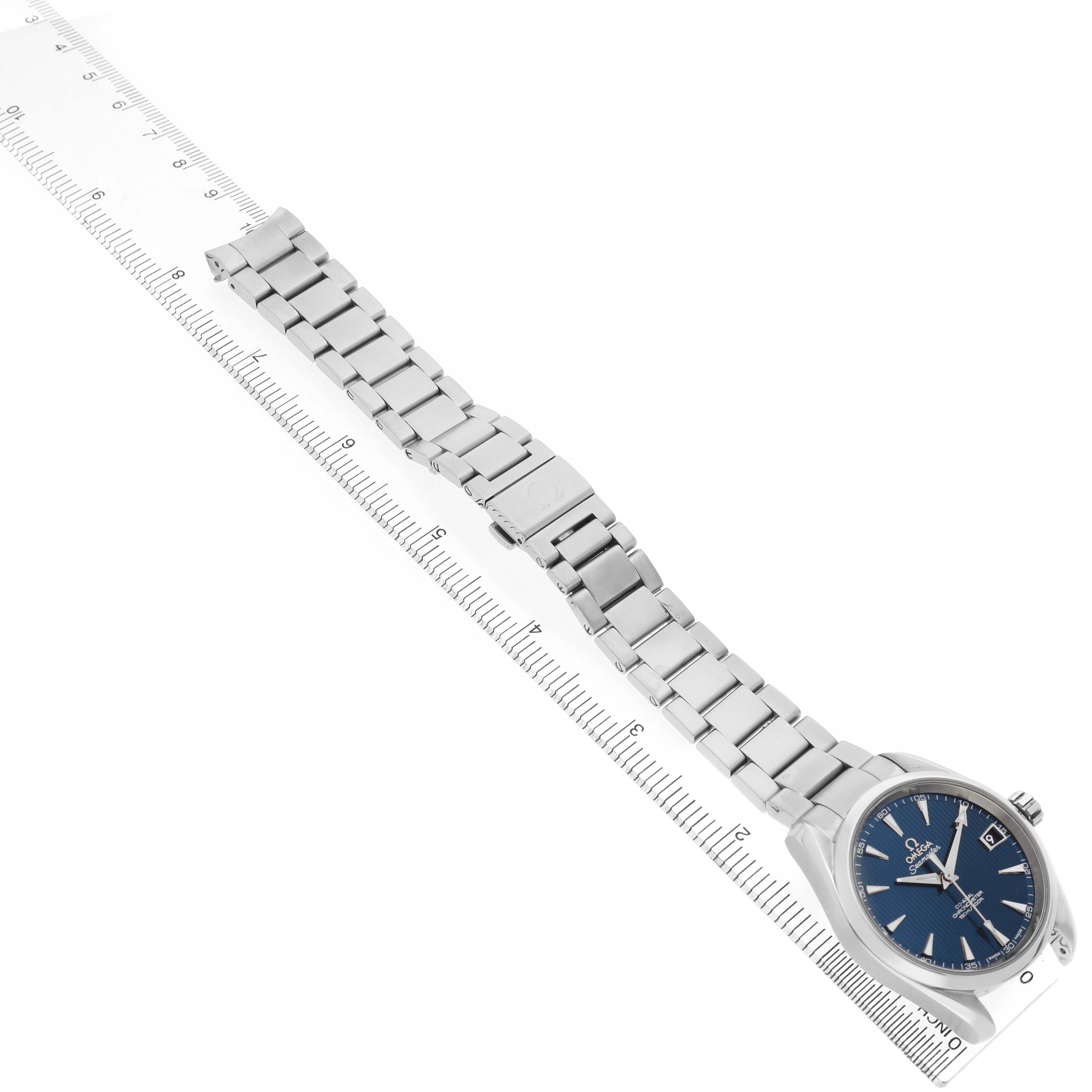 The image shows the Omega Aqua Terra 231.10.39.21.03.001 Men's Stainless Steel Blue Dial watch from a top angle, displaying its face, strap, and clasp, alongside a ruler for scale.