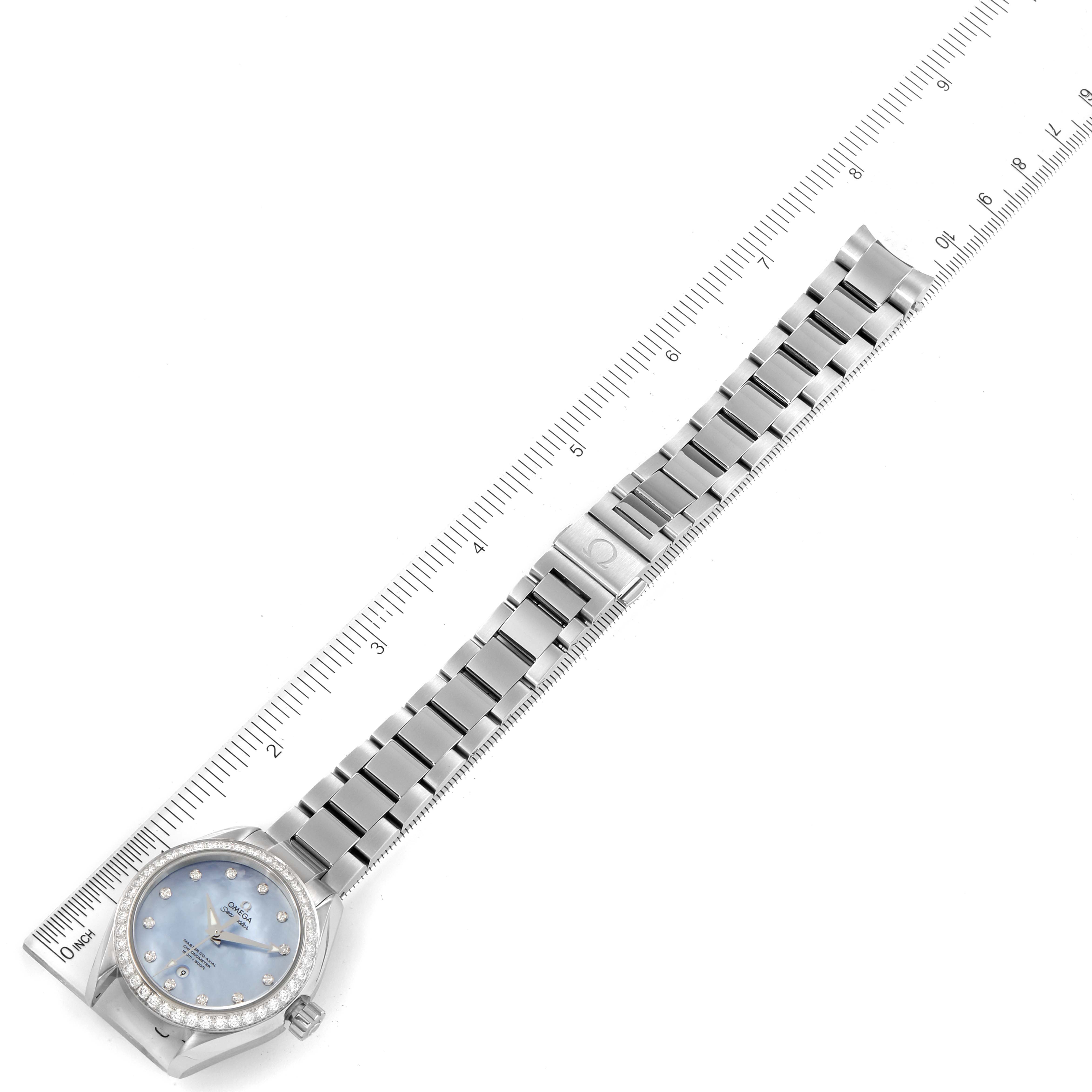 The image shows an Omega 231.15.34.20.57.002 Women
s Stainless Steel Mother of Pearl Dial 231.15.34.20.57.002 Women
s Stainless Steel Mother of Pearl Dial Seamaster Aqua Terra MOP Diamond Steel Ladies Watch 231.15.34.20.57.002 laid flat with a ruler.