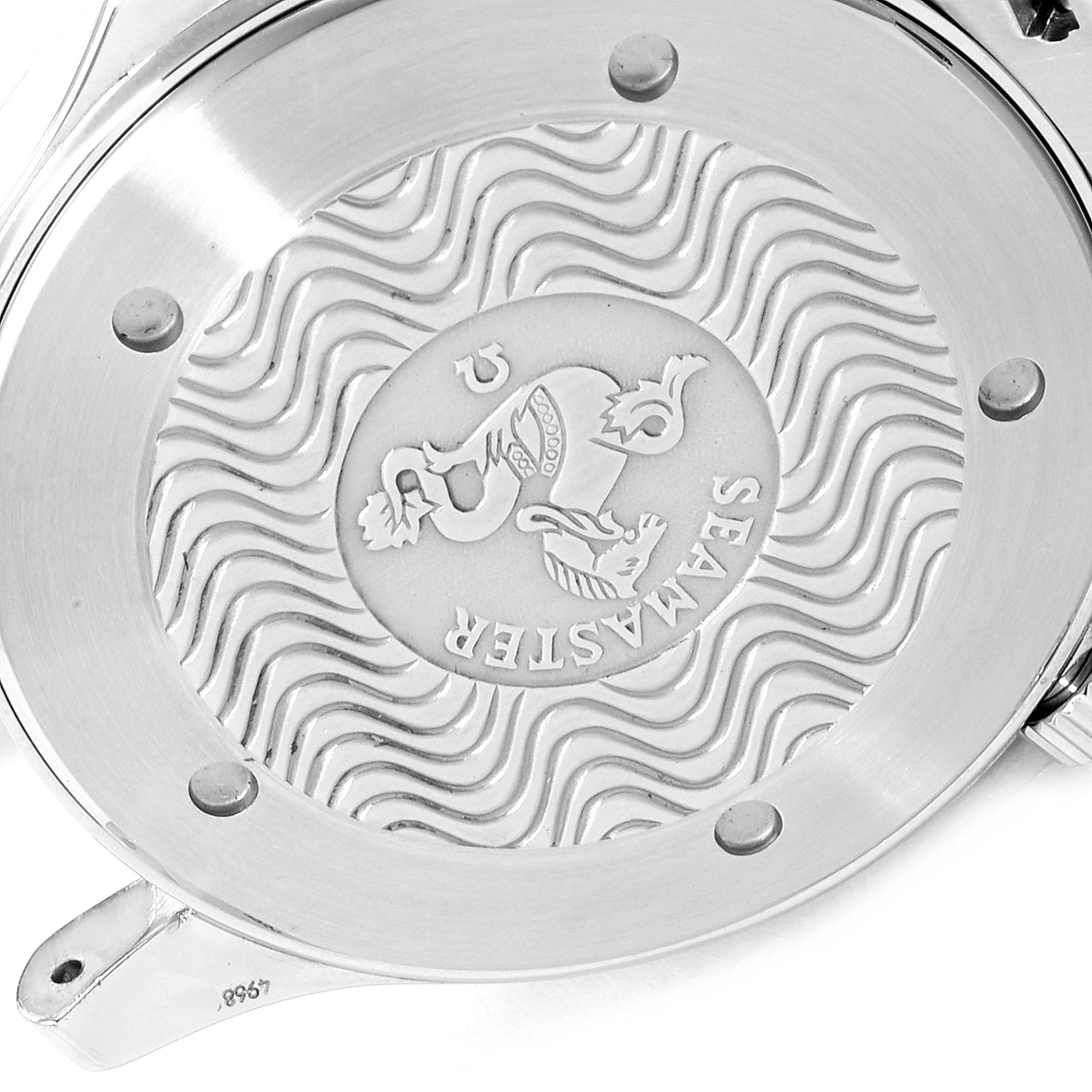 The image shows the case back of the Omega Seamaster 2532.80.00 Men's Stainless Steel Blue Dial 2532.80.00 Men's Stainless Steel Blue Dial watch featuring engravings and wave patterns.