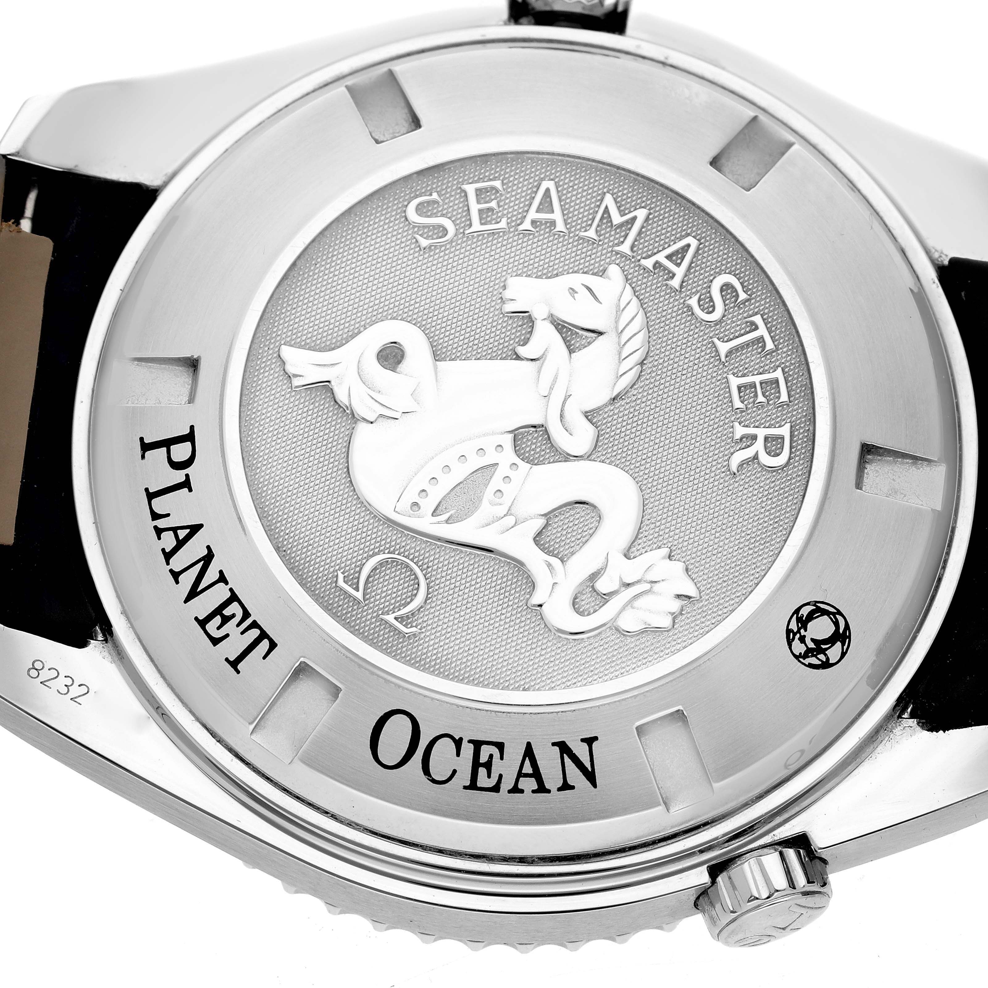 The image shows the back case of the Omega Seamaster Planet Ocean watch, focusing on the engraved details.