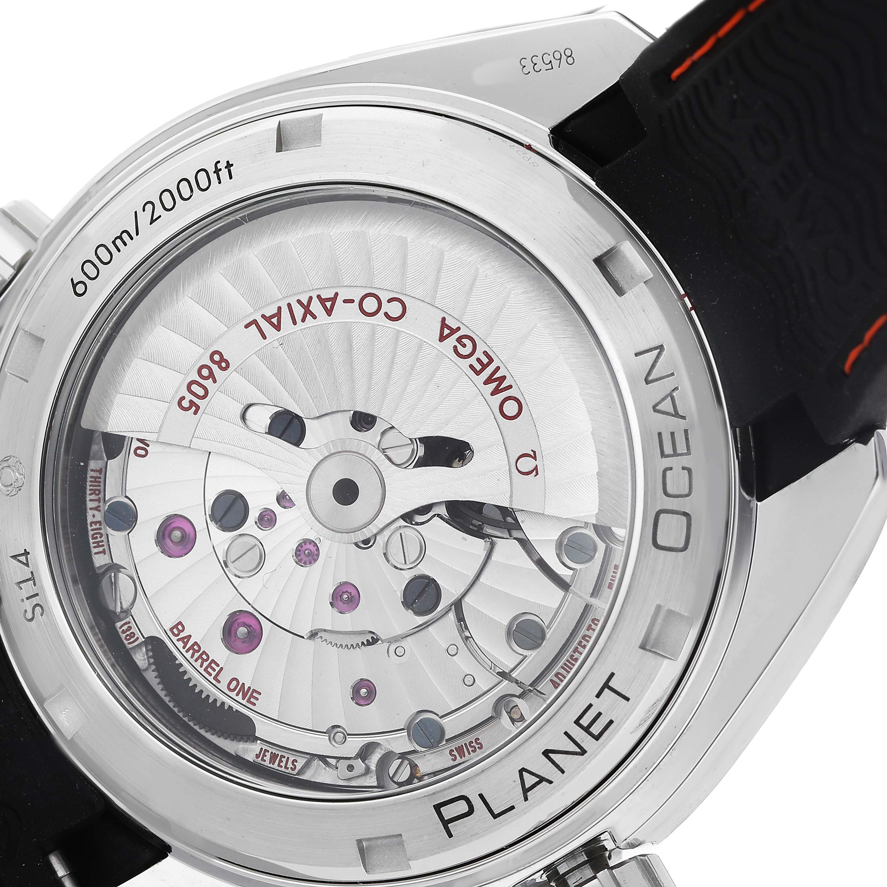 The image shows the back view of the Omega Planet Ocean 232.32.44.22.01.002 Men's Stainless Steel Black Dial watch, highlighting the movement and internal components.