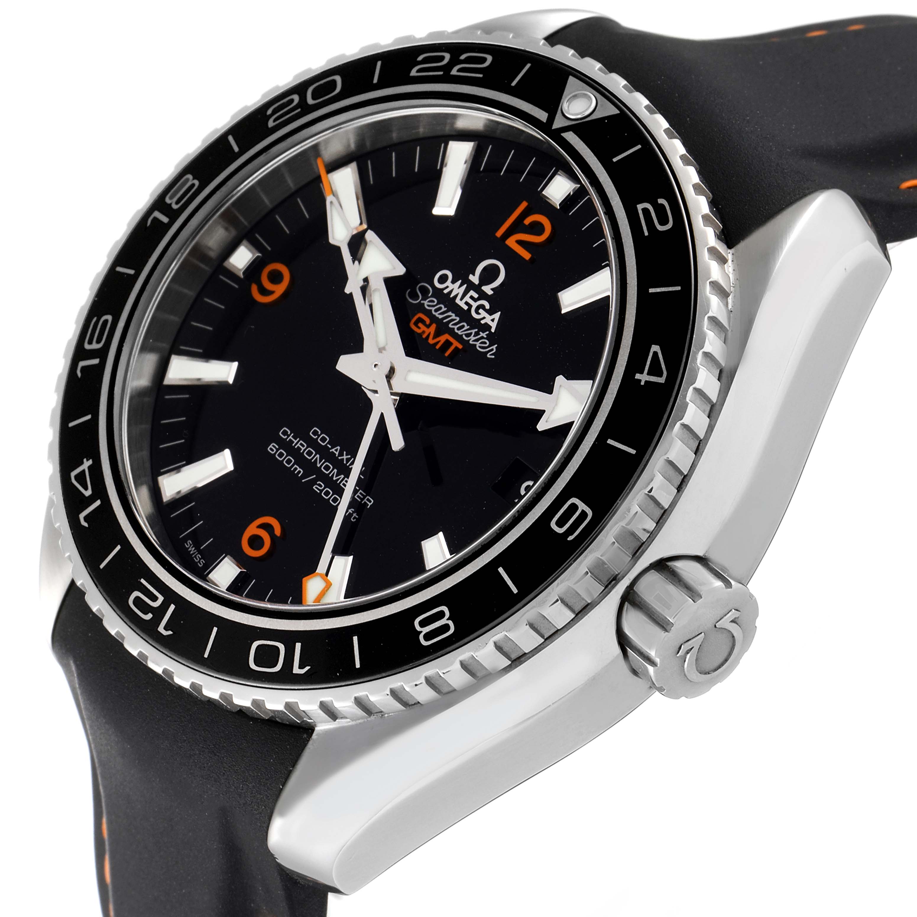The image shows a close-up, angled view of the dial, bezel, and crown of an Omega Seamaster Planet Ocean GMT watch.
