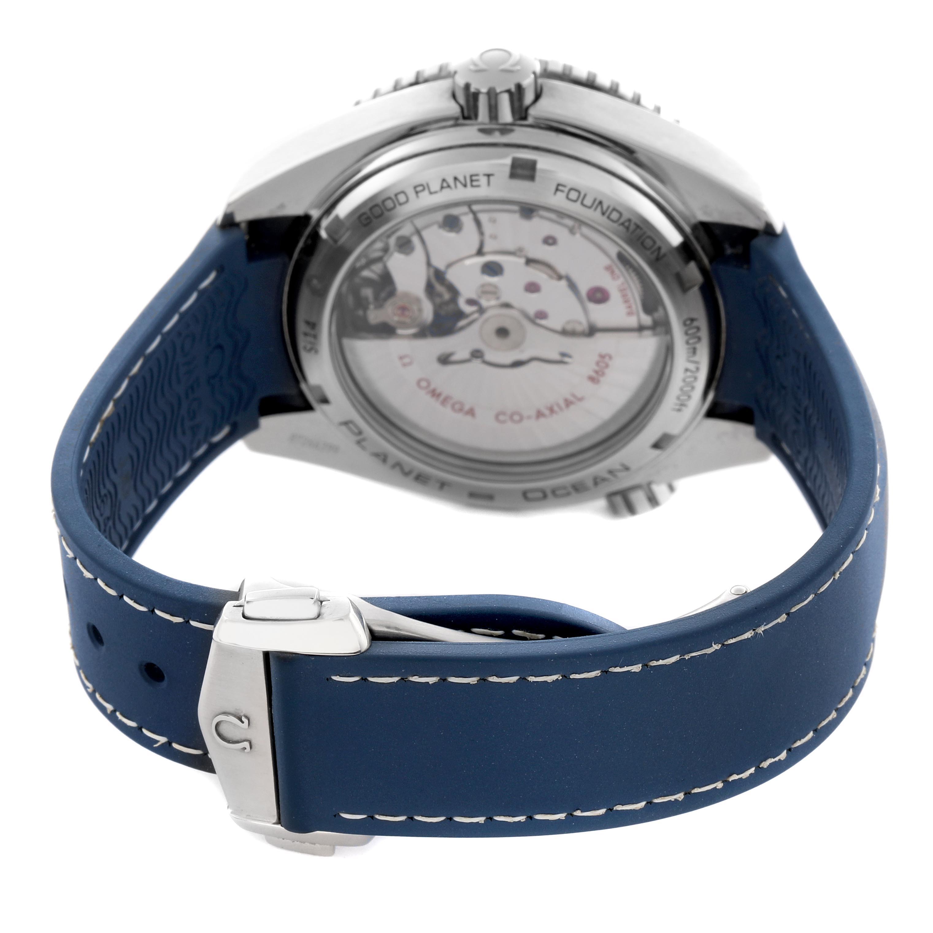 The Omega Planet Ocean 232.32.44.22.03.001 Men's Stainless Steel Blue Dial 232.32.44.22.03.001 Men's Stainless Steel Blue Dial watch is shown from the back, displaying its mechanical movement and blue strap with stitching.