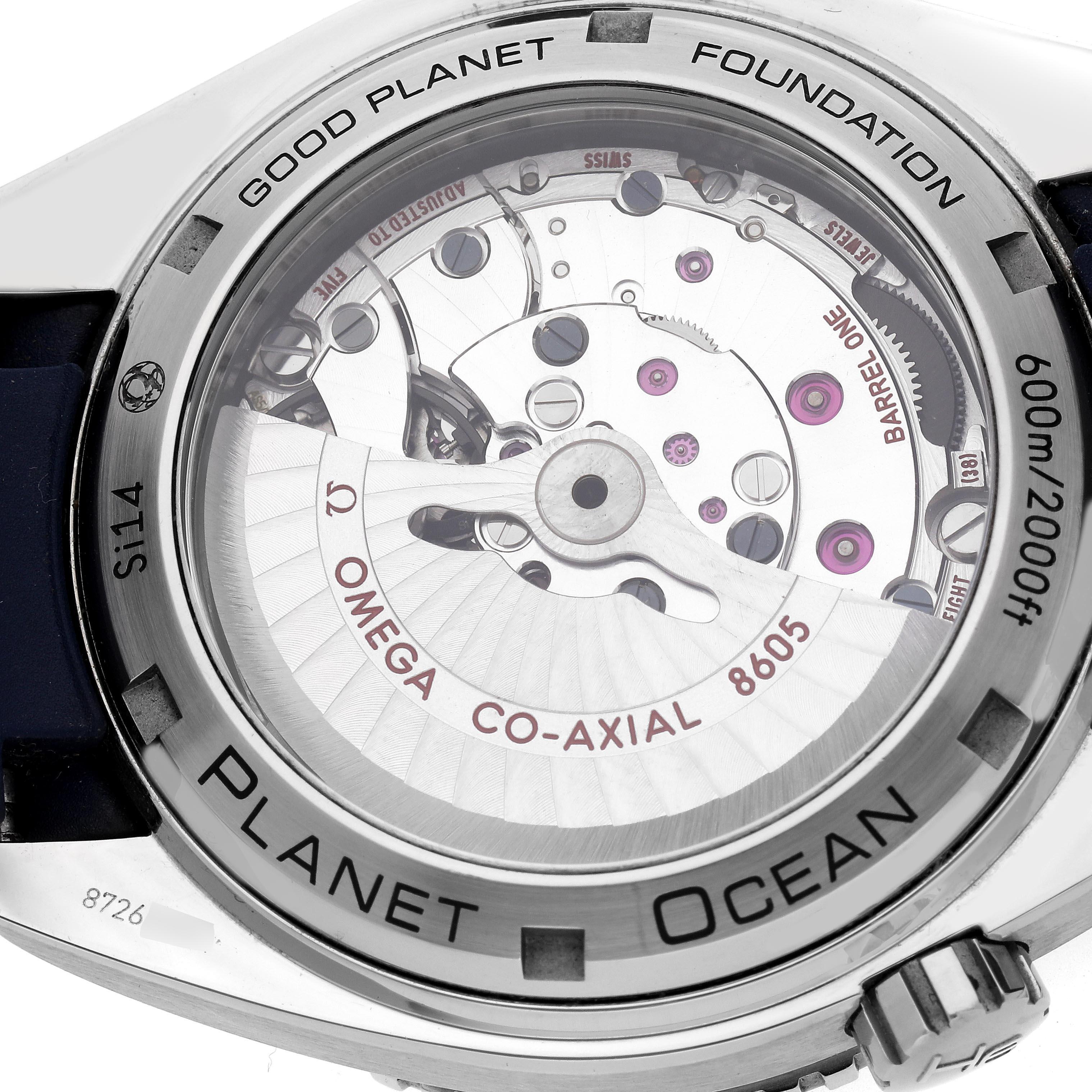 The image shows the back view of the Omega Planet Ocean 232.32.44.22.03.001 Men's Stainless Steel Blue Dial 232.32.44.22.03.001 Men's Stainless Steel Blue Dial watch, highlighting the Co-Axial 8605 movement and case engravings.