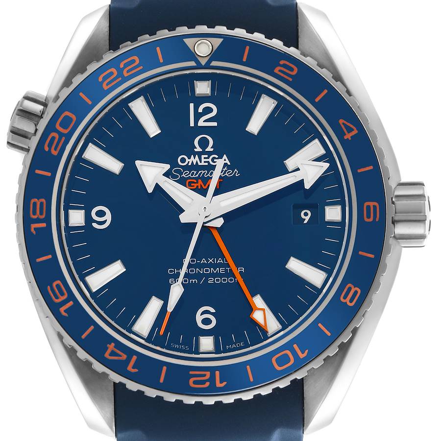 The Omega Seamaster Planet Ocean watch face is shown head-on, featuring a blue dial, GMT hand, and a rotating bezel with orange numerals.
