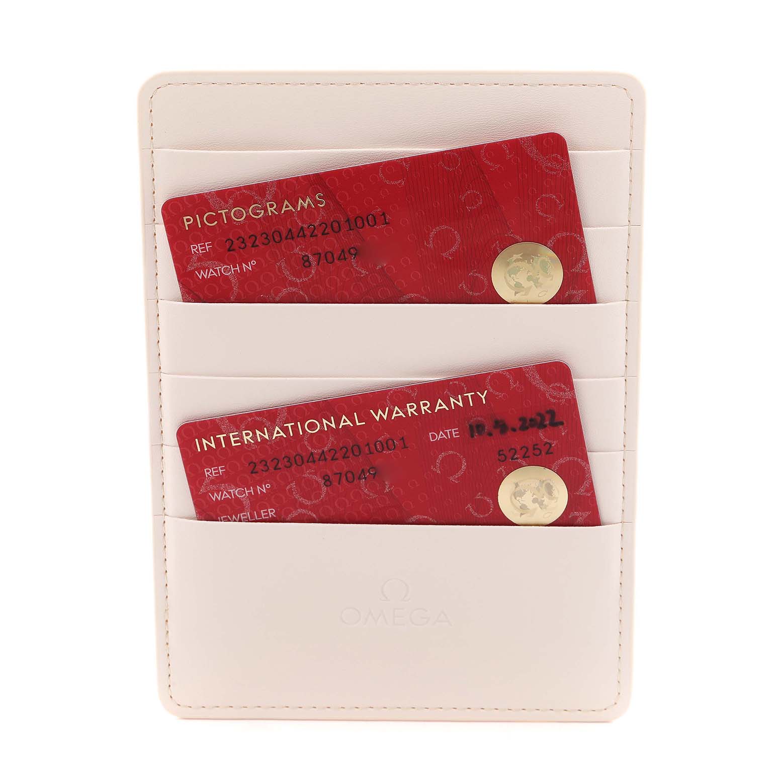 The image shows the warranty and pictogram cards for the Omega Planet Ocean 232.30.44.22.01.001 Men
s Stainless Steel Black Dial 232.30.44.22.01.001 Men
s Stainless Steel Black Dial model in a beige cardholder.