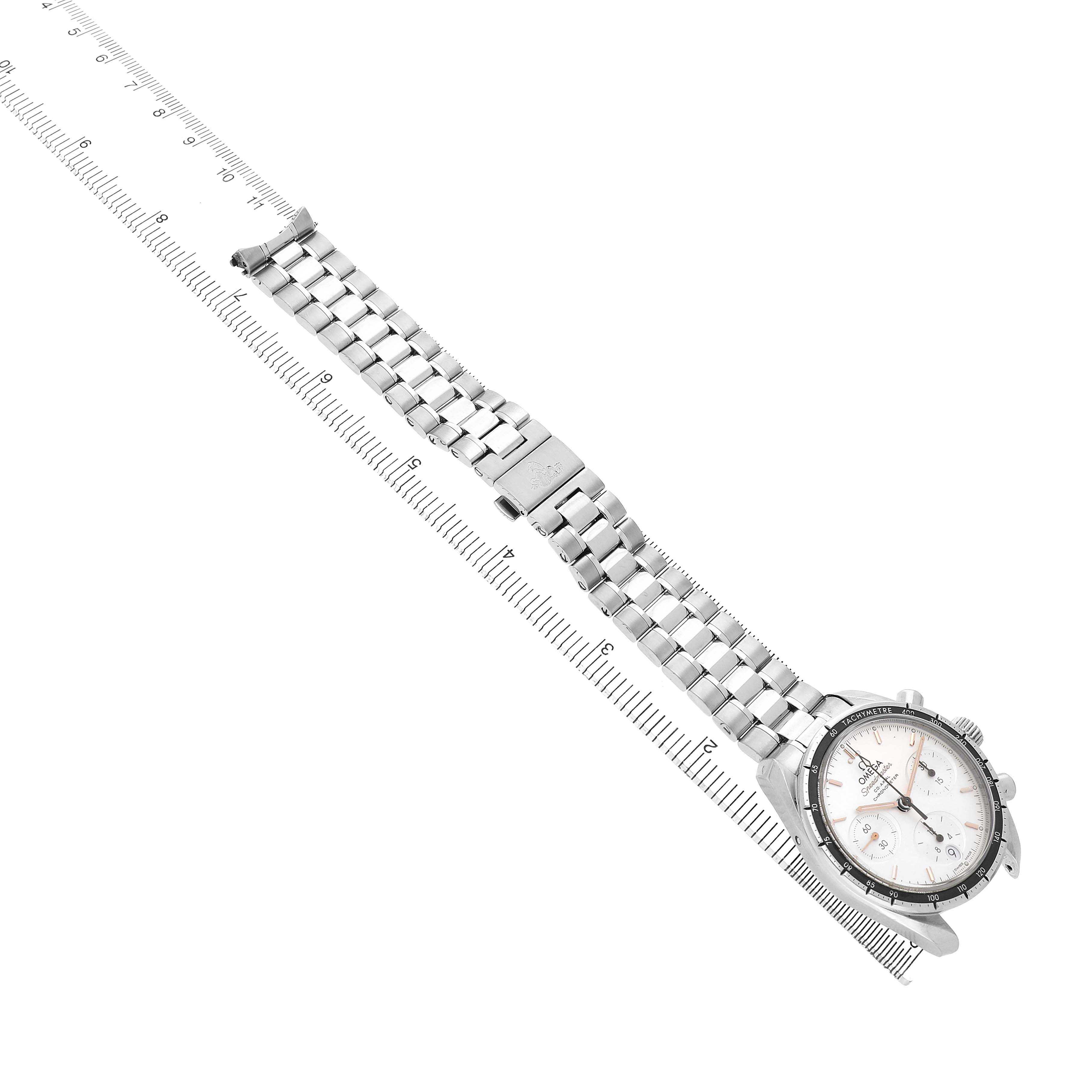 The Omega Speedmaster 324.30.38.50.02.001 Men's Stainless Steel Silver Dial watch is shown at a diagonal angle, focusing on the bracelet and clasp with a measuring scale underneath.