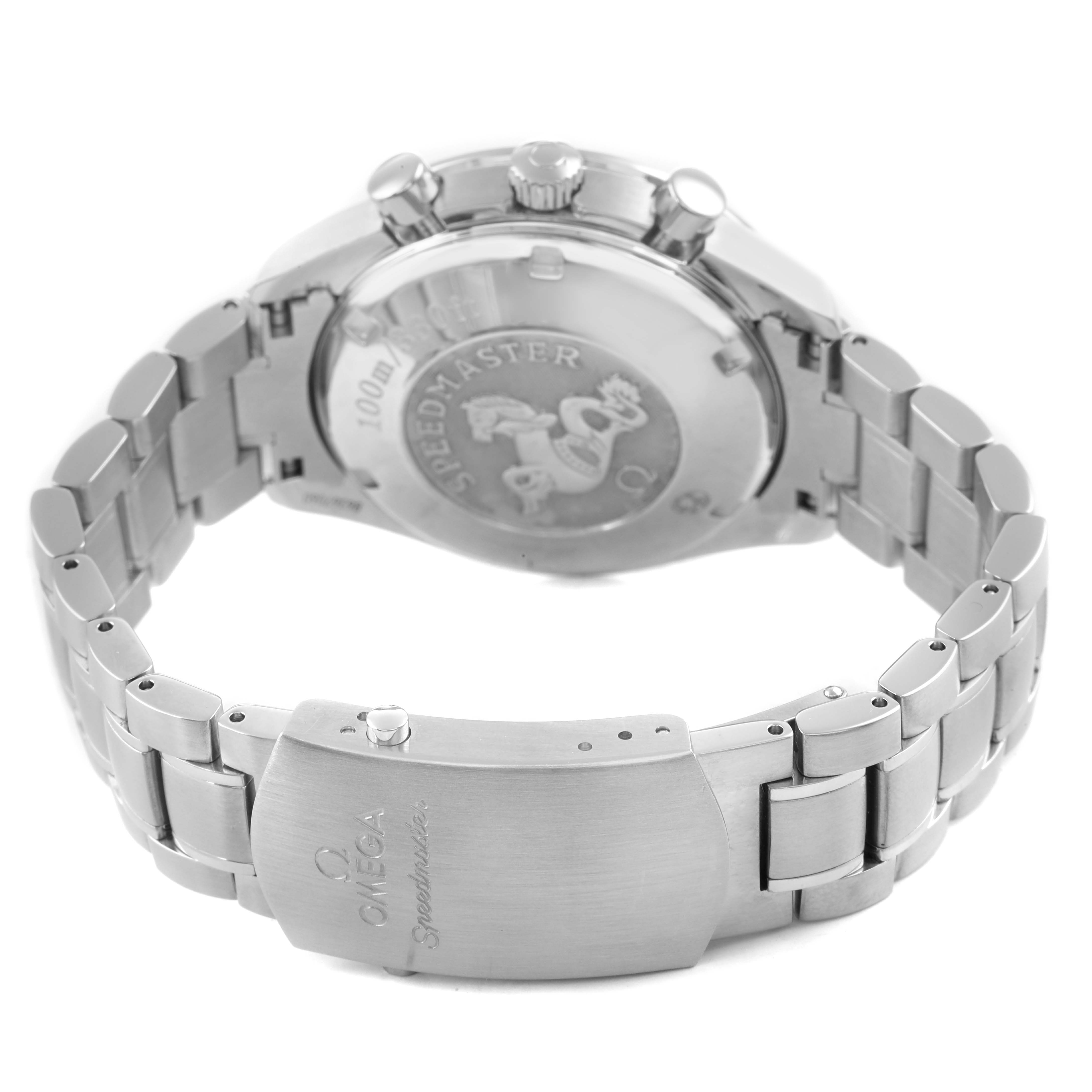 The image shows the back case and bracelet clasp of the Omega Speedmaster 3210.50.00 Men's Stainless Steel Black Dial, highlighting the engraved emblem and branding.