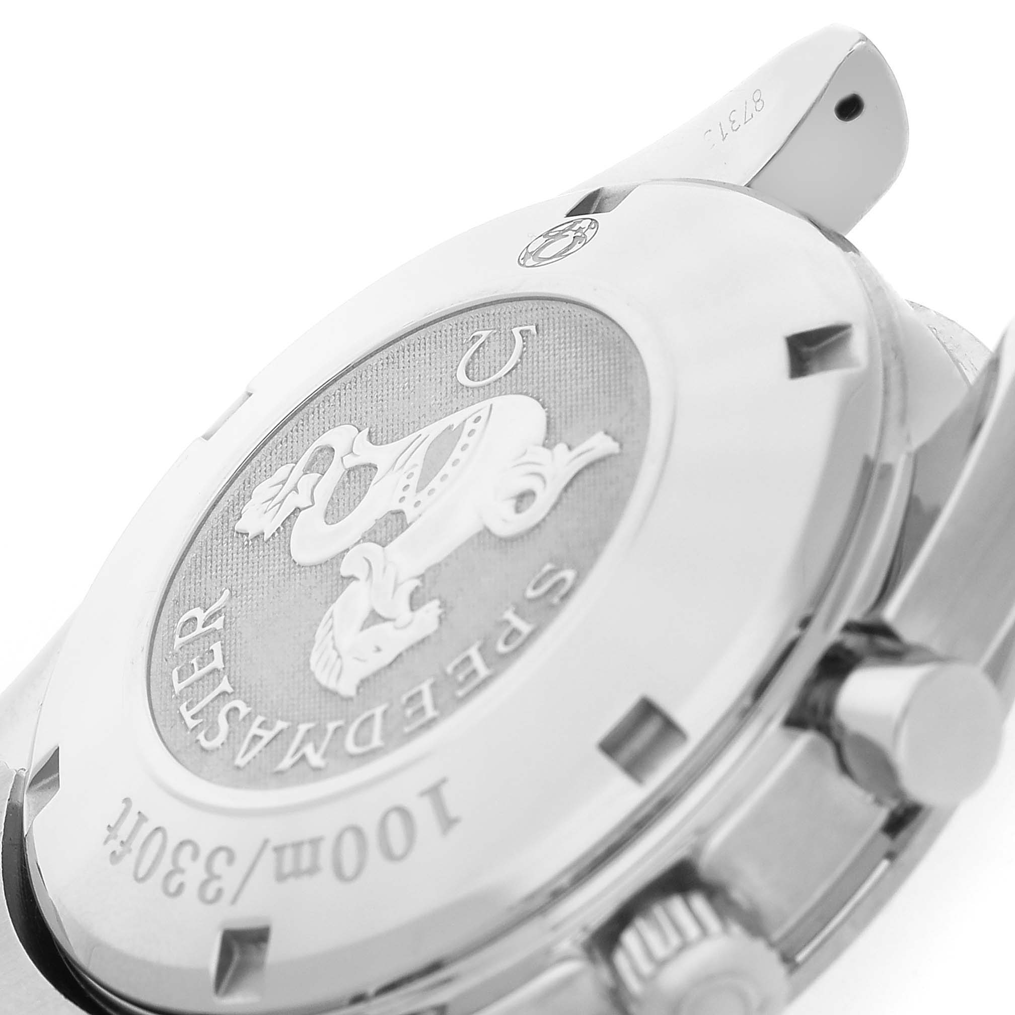 The image shows the back case of an Omega Speedmaster 323.30.40.40.06.001 Men's Stainless Steel Grey Dial watch, featuring the logo and text engravings.