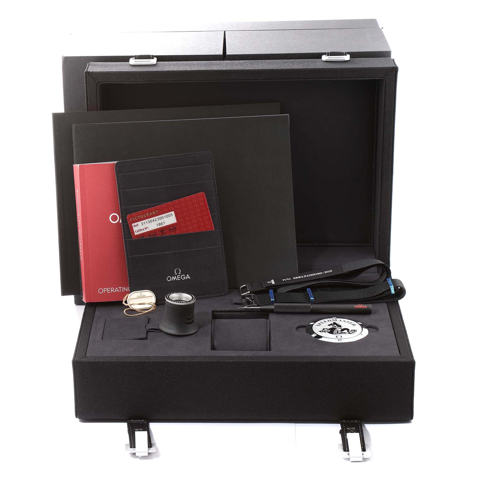 The image shows the packaging and accessories of the Omega Speedmaster 311.30.42.30.01.005 Men
s Stainless Steel Black Dial 311.30.42.30.01.005 Men
s Stainless Steel Black Dial, including manuals, a magnifying glass, straps, and certification cards.