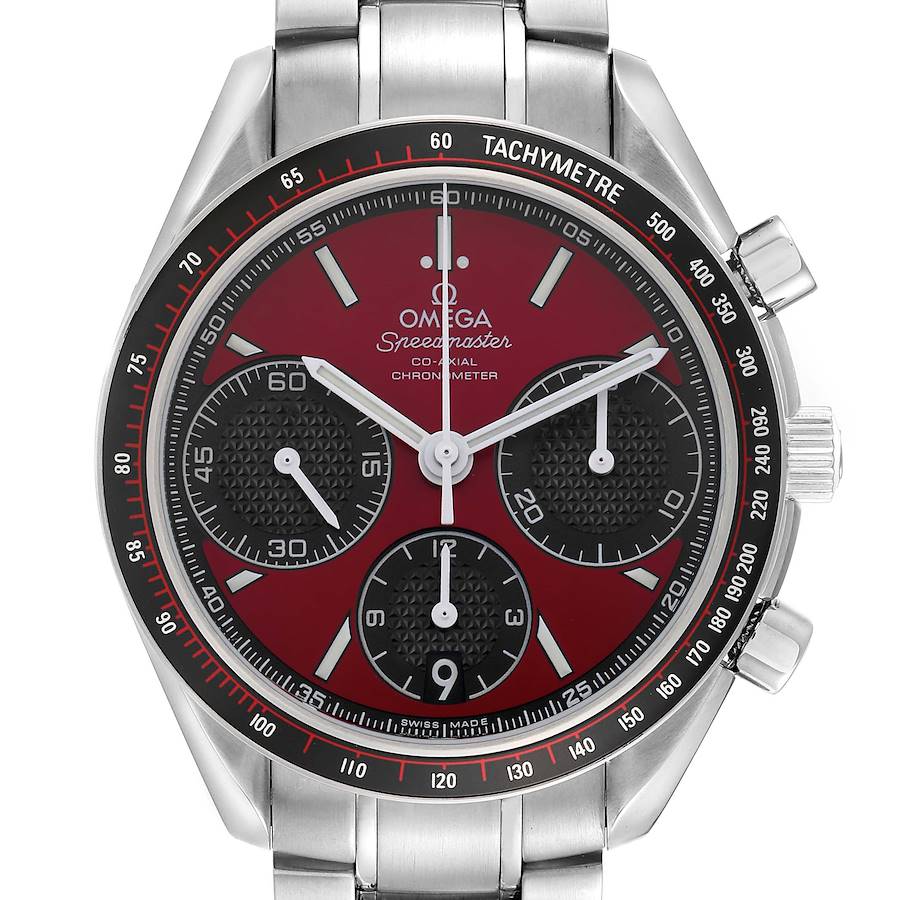 The Omega Speedmaster watch is shown from a top-down view, highlighting the red dial, sub-dials, tachymeter bezel, and metal bracelet.