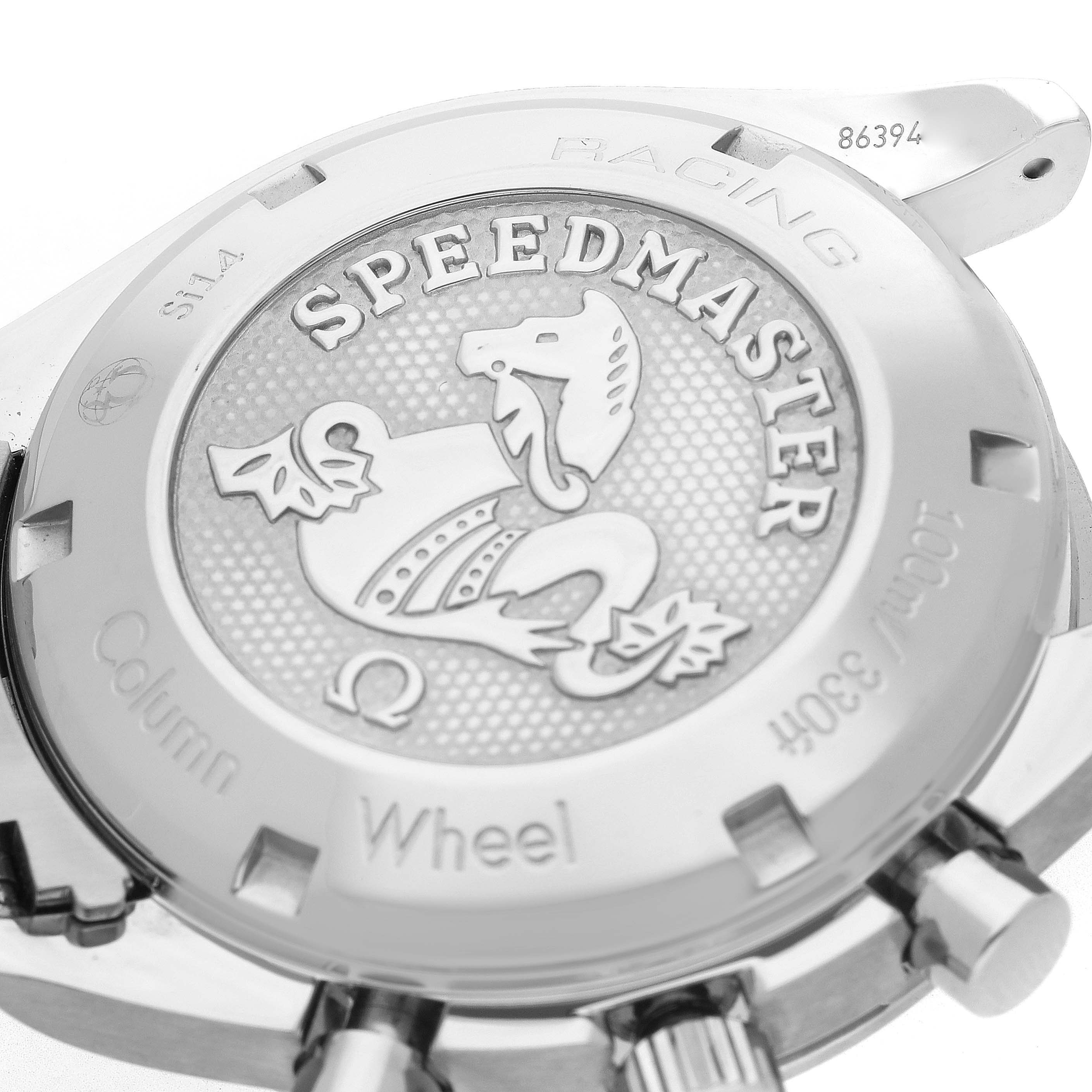 The image shows the case back of an Omega Speedmaster 326.30.40.50.11.001 Men's Stainless Steel Red Dial 326.30.40.50.11.001 Men's Stainless Steel Red Dial, highlighting the "Racing" and "Column Wheel" engravings.