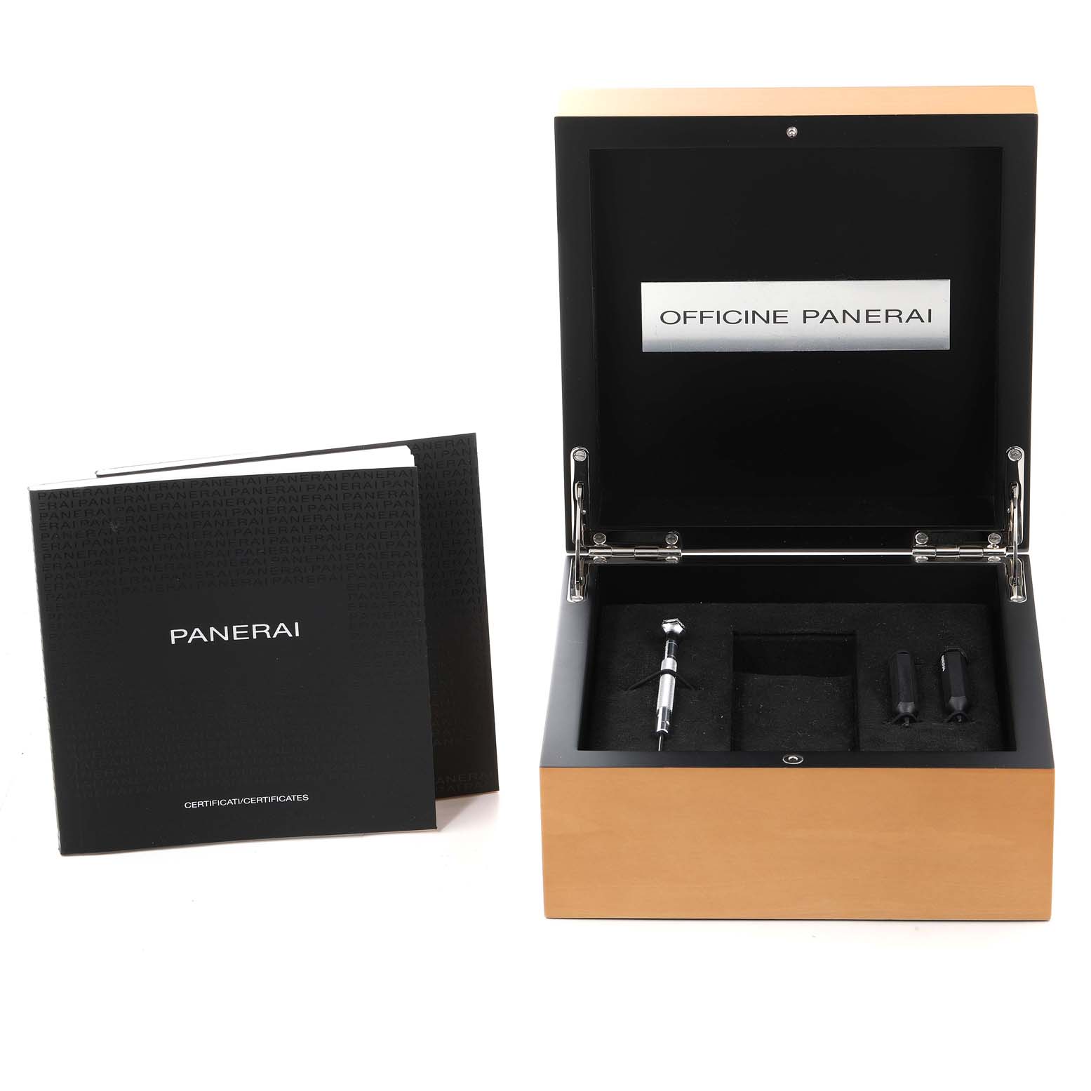 The image shows the Panerai Luminor PAM01351 Men
s Titanium Brown Dial PAM01351 Men
s Titanium Brown Dial model
s open black box with accessory compartments and an accompanying booklet.