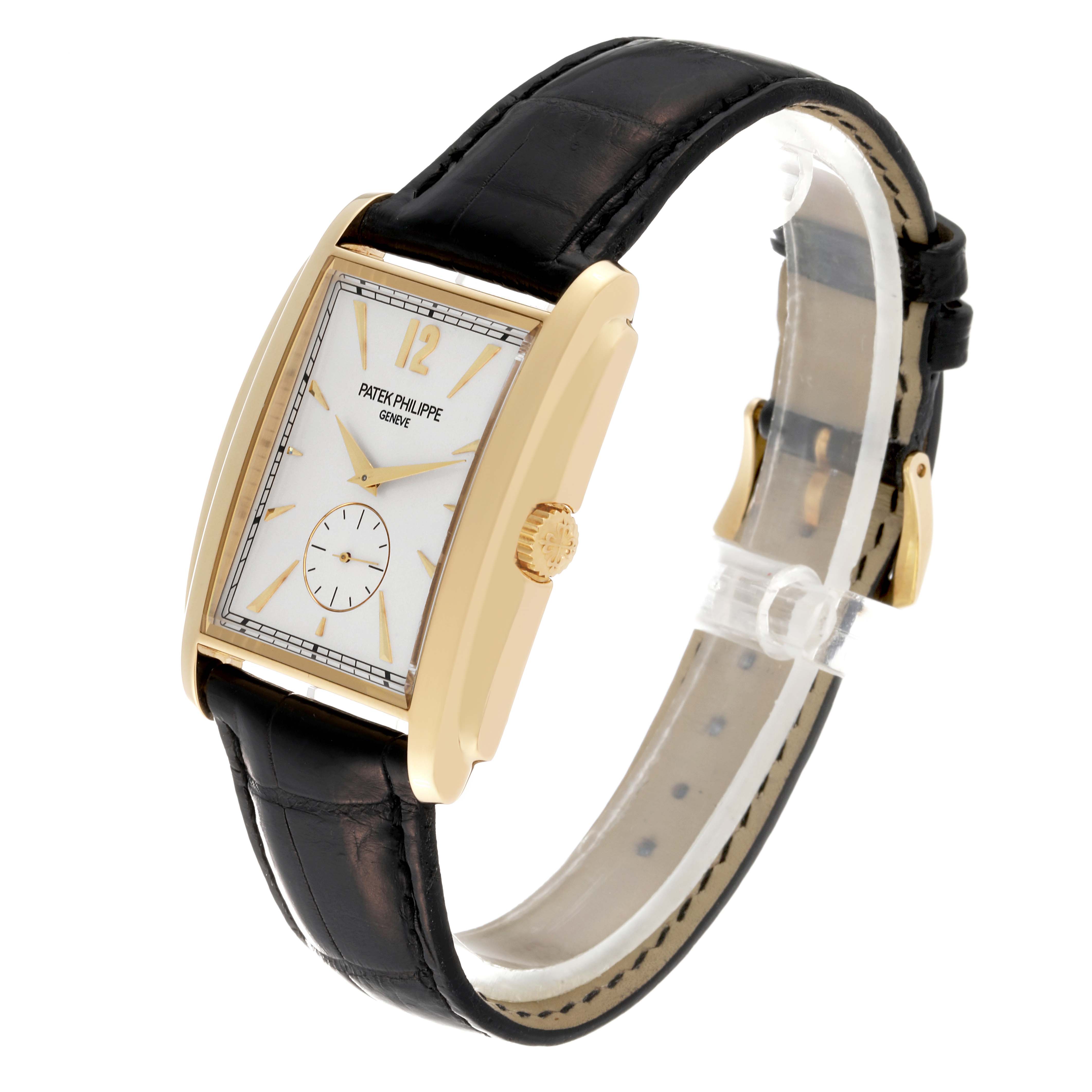 The Patek Philippe Gondolo 5124J Men's Yellow Gold Silver Dial 5124J Men's Yellow Gold Silver Dial watch is shown at a three-quarter angle, displaying the face, side, crown, and strap.