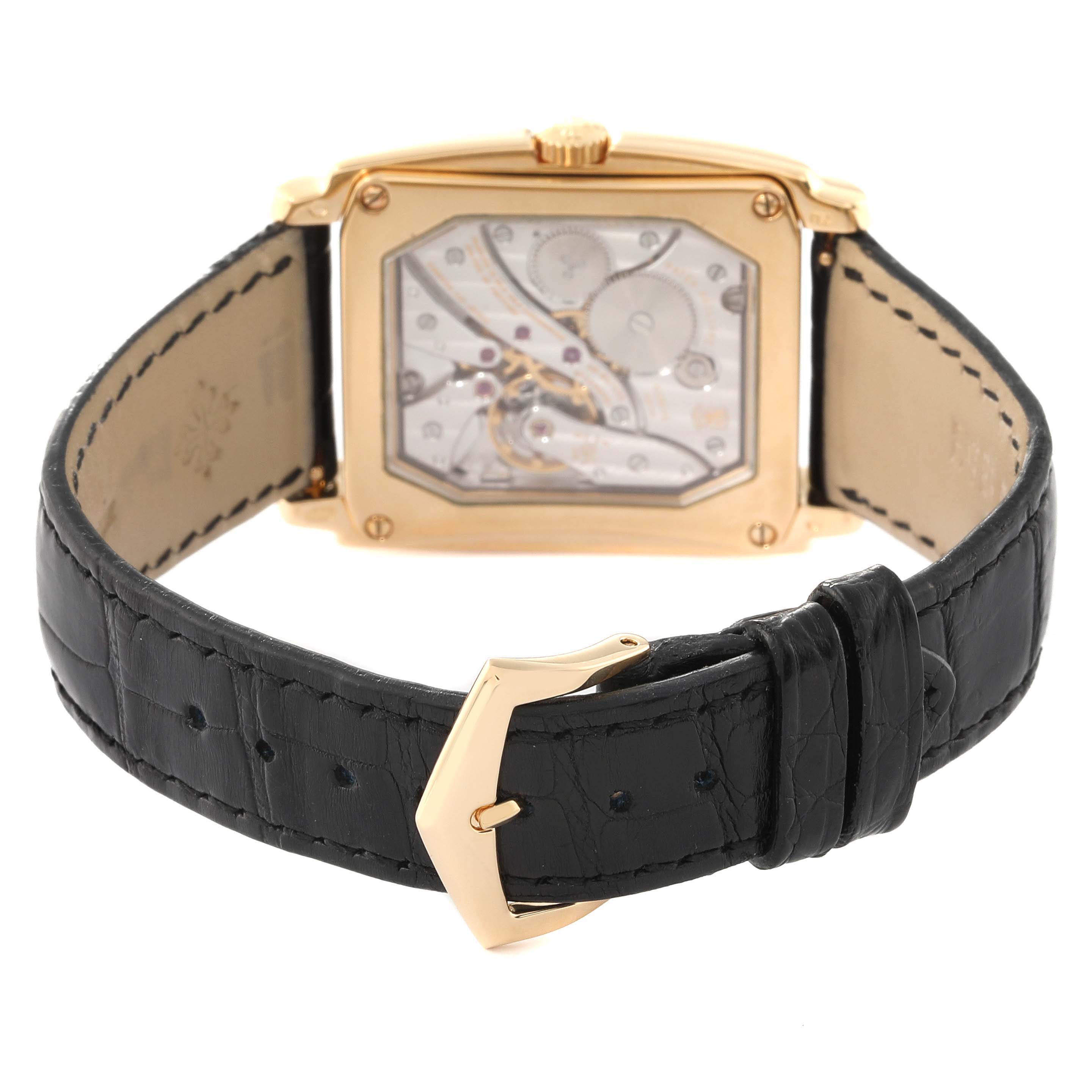 This image shows the back view and buckle of the Patek Philippe Gondolo 5124J Men's Yellow Gold Silver Dial 5124J Men's Yellow Gold Silver Dial watch, highlighting its movement and black leather strap.