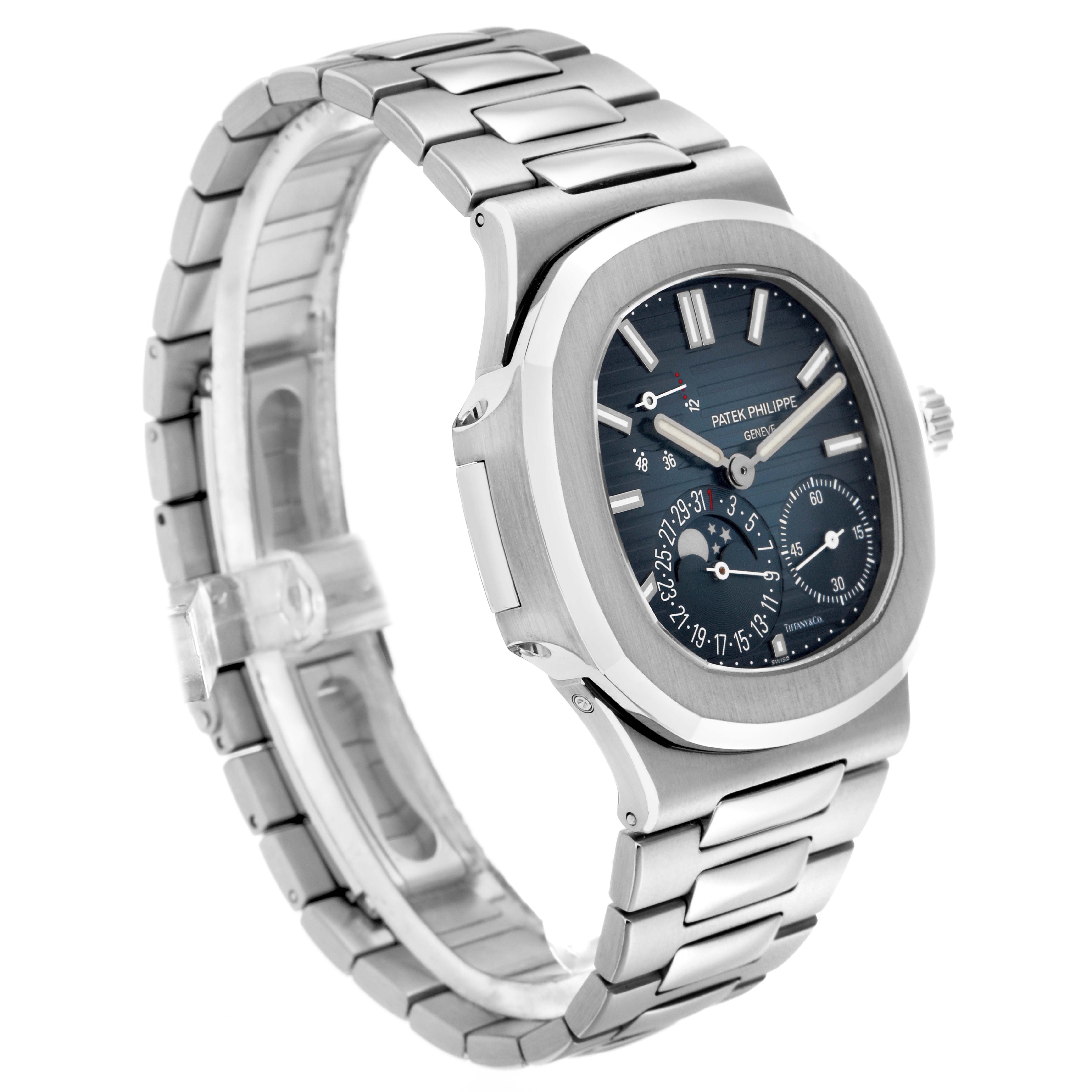 This image shows a Patek Philippe Nautilus 5712/1A-001 Men's Stainless Steel Blue Dial watch at a slight angled view, highlighting the face, bezel, pushers, and bracelet.