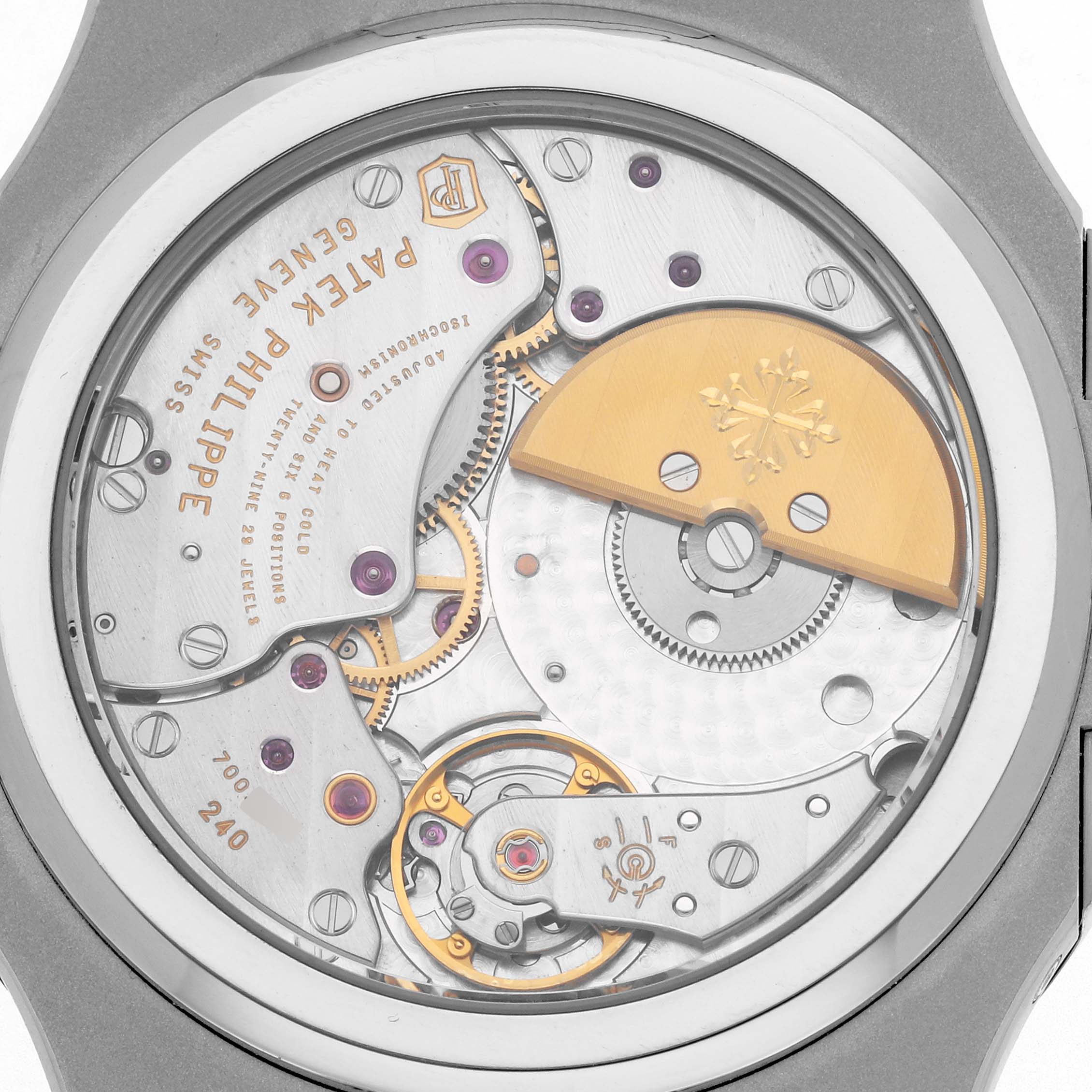 The image shows a close-up of the Patek Philippe Nautilus 5712/1A-001 Men's Stainless Steel Blue Dial watch movement from the back, highlighting its intricate mechanical parts.