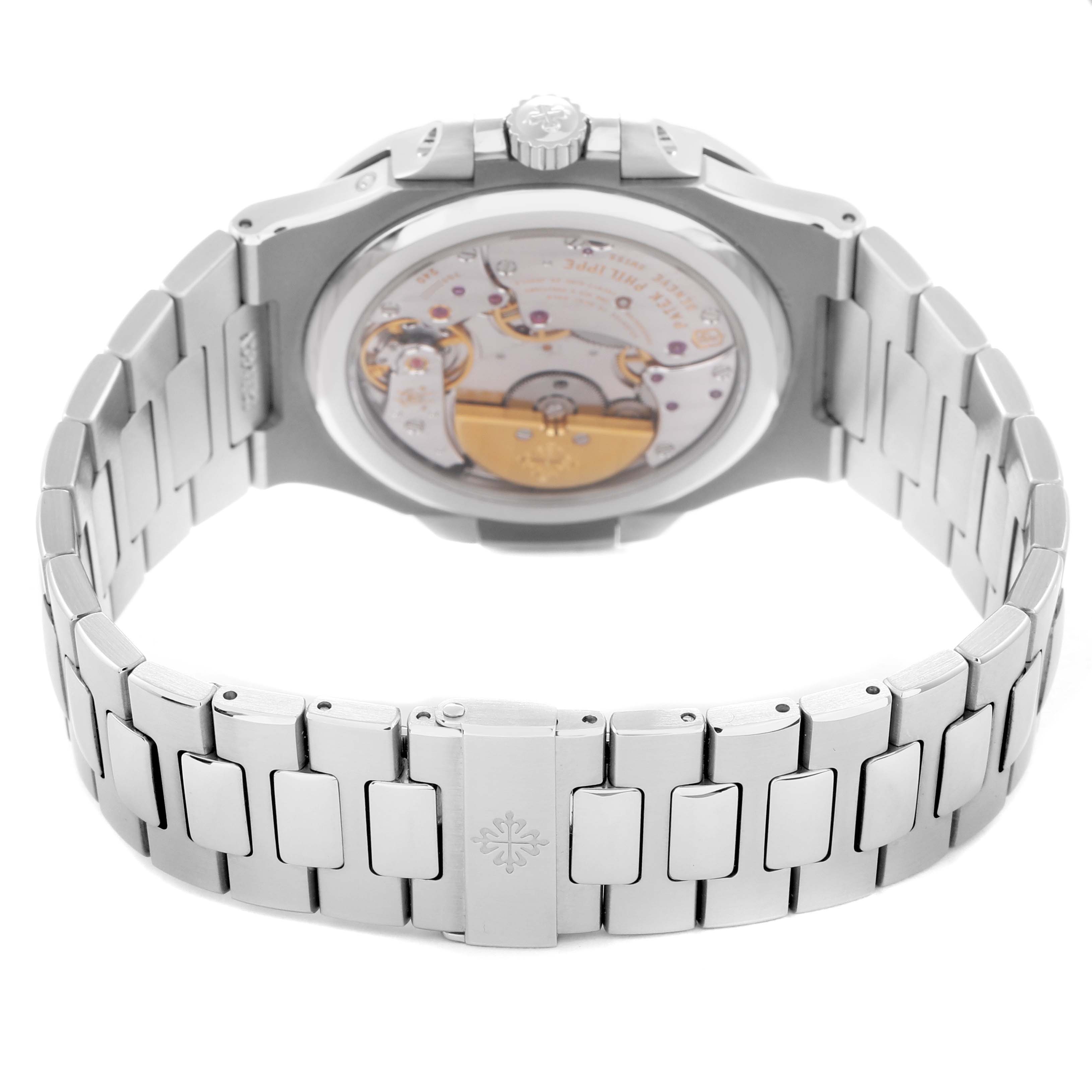 The image shows the back of the Patek Philippe Nautilus 5712/1A-001 Men's Stainless Steel Blue Dial watch, displaying the movement and bracelet clasp.