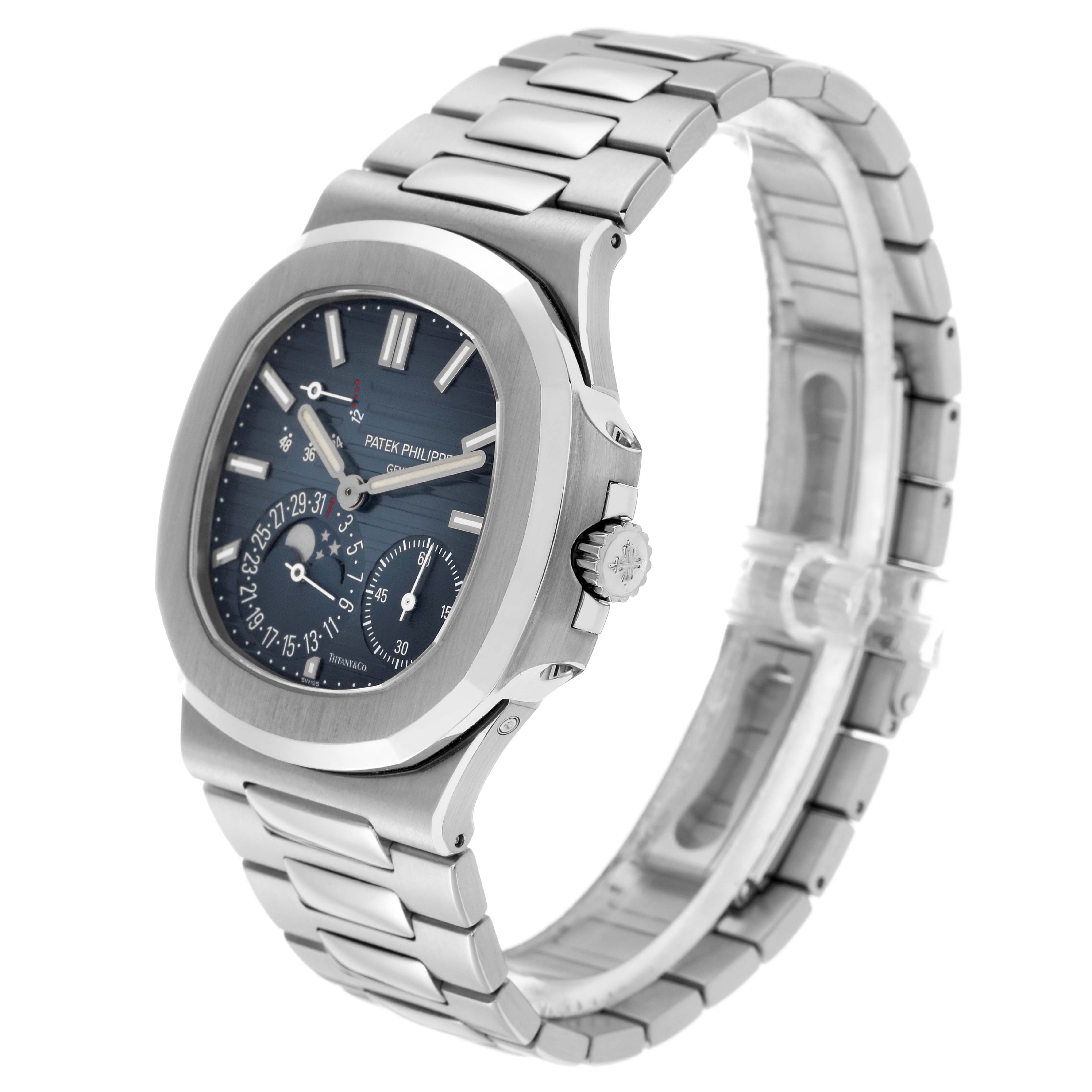 The Patek Philippe Nautilus 5712/1A-001 Men's Stainless Steel Blue Dial watch is shown from a side angle, highlighting the dial, crown, and stainless steel bracelet.