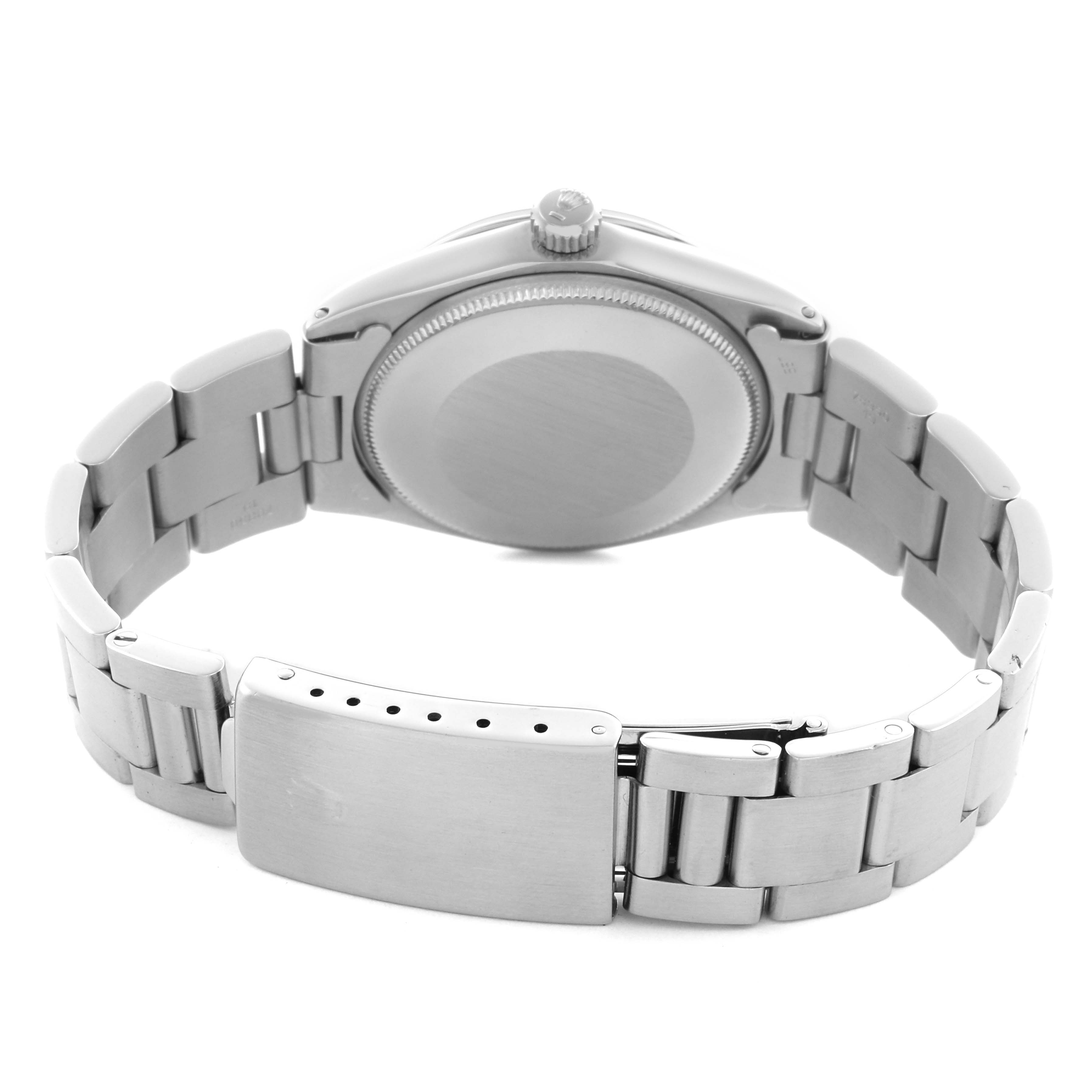 The image shows the back and bracelet of a Rolex Air-King watch, highlighting the clasp and case back.