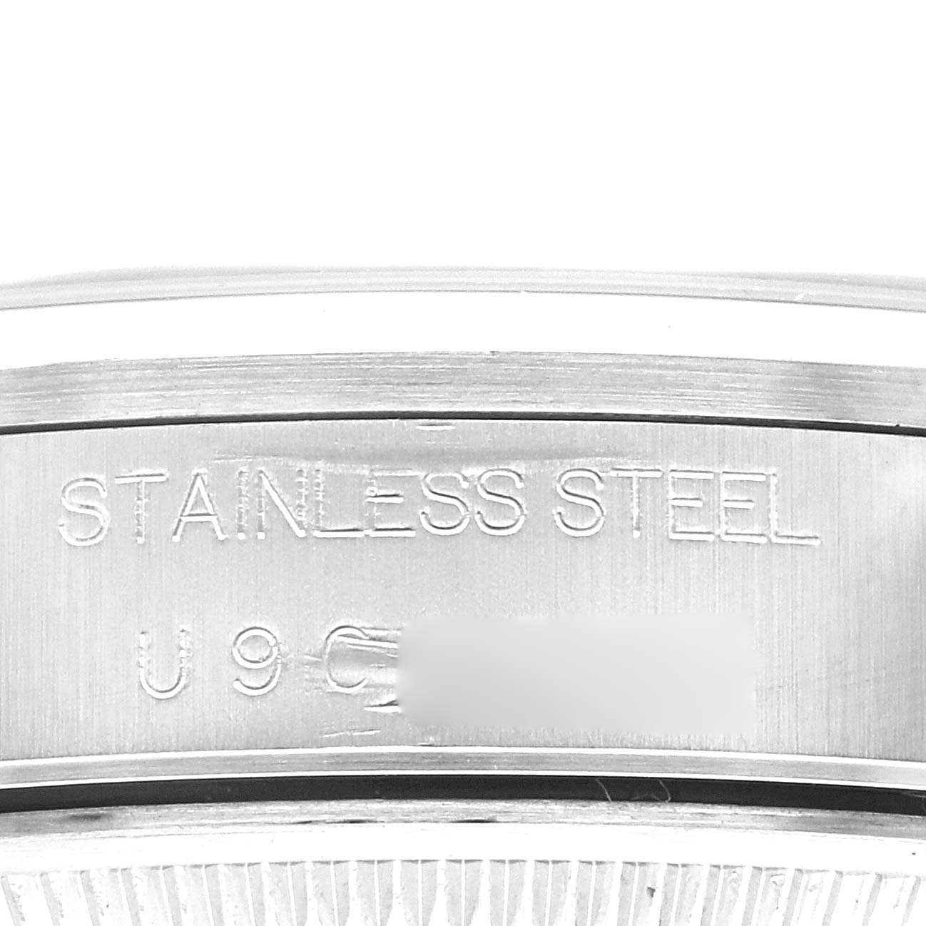 This image shows the side view of the stainless steel case back of a Rolex Air-King 14000 Men's Stainless Steel Silver Dial 14000 Men's Stainless Steel Silver Dial watch, highlighting the material and a partial serial number.