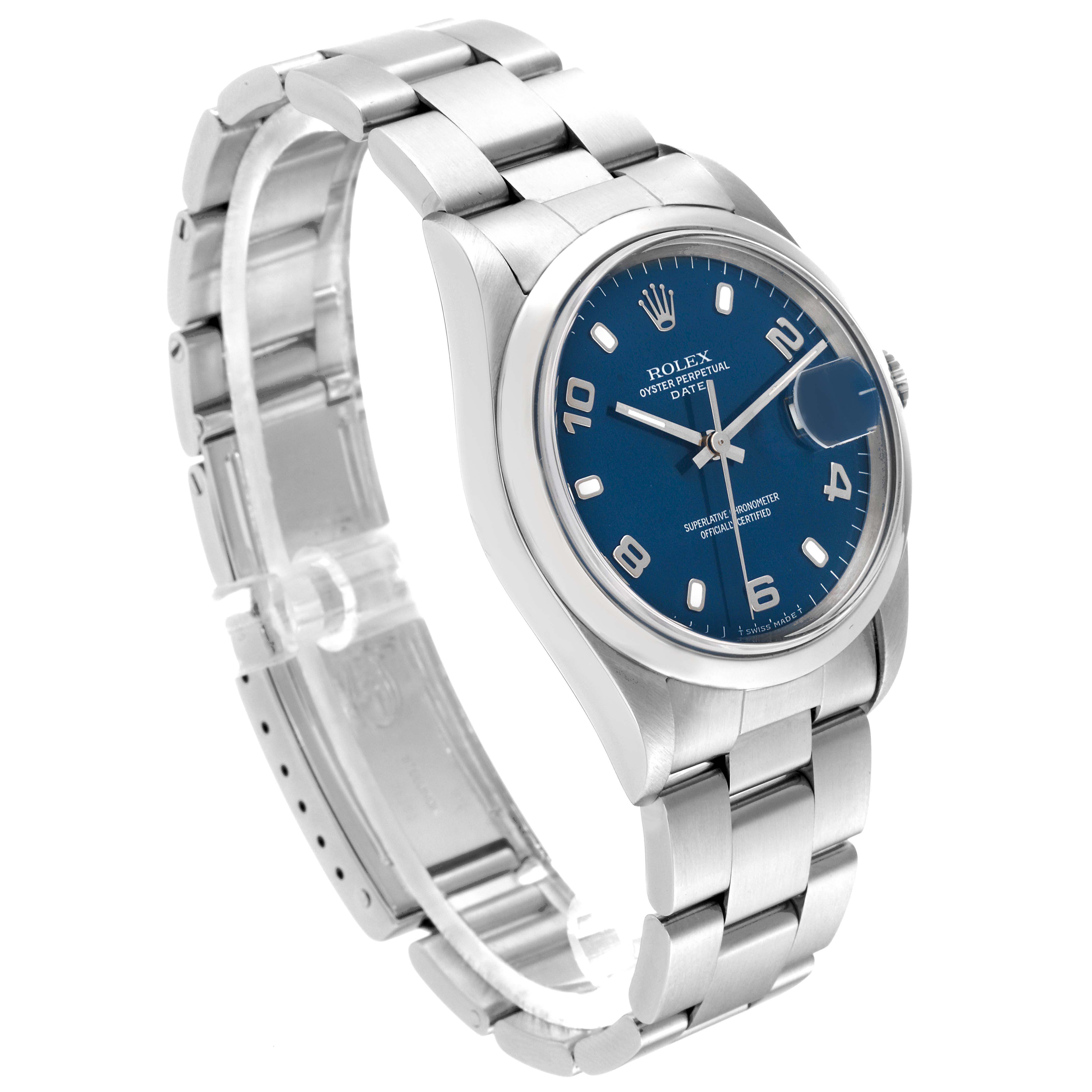 The image shows a Rolex Oyster Perpetual Date watch with a blue dial and silver bracelet at a three-quarter angle.