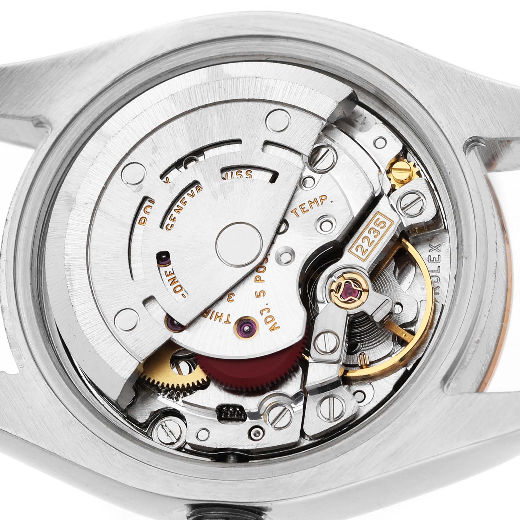 The image shows the movement mechanism of a Rolex Datejust 179171 Women's Steel and Gold (two tone) Silver Dial, highlighting gears, wheels, and intricate components.
