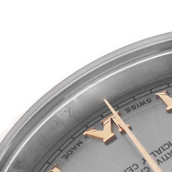 The image shows a close-up of the upper part of a Rolex Datejust 179171 Women's Steel and Gold (two tone) Silver Dial watch face, focusing on the hour markers and hands.