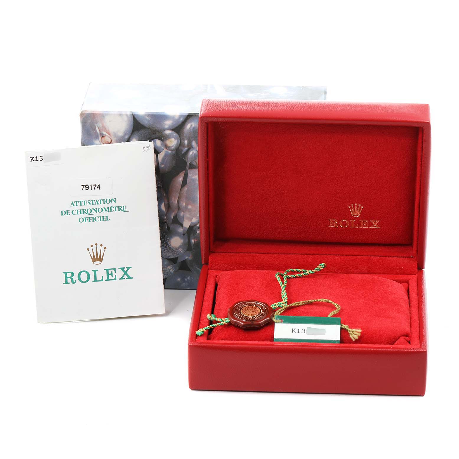 The image shows the Rolex Datejust 79174 Women's Stainless Steel Silver Dial 79174 Women's Stainless Steel Silver Dial watch's red box, official chronometer certificate, and accessories from a frontal angle.