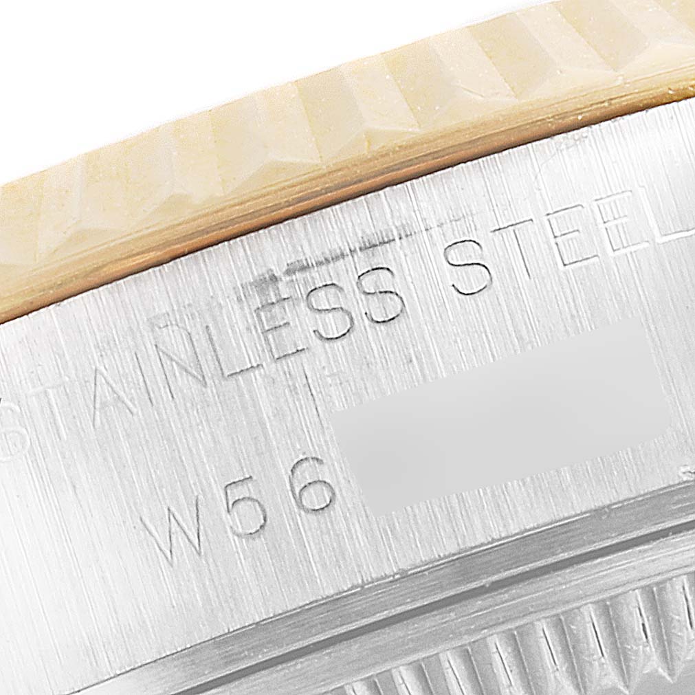 This image shows a close-up of the side of the casing on a Rolex Datejust 69173 Women's Steel and Gold (two tone) Champagne Dial 69173 Women's Steel and Gold (two tone) Champagne Dial watch, focusing on the stainless steel engraving.