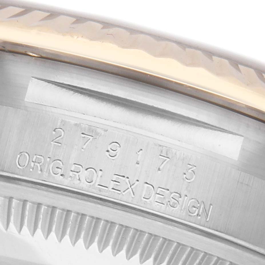 The image shows a close-up of the Rolex Datejust 279173 Women's Steel and Gold (two tone) Champagne Dial 279173 Women's Steel and Gold (two tone) Champagne Dial model's case with the serial number and "ORIG ROLEX DESIGN" engraving.