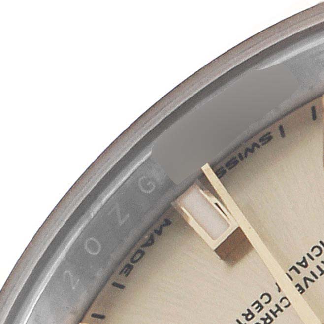 The image shows a close-up of the dial and bezel edge of a Rolex Datejust 279173 Women's Steel and Gold (two tone) Champagne Dial 279173 Women's Steel and Gold (two tone) Champagne Dial, focusing on the minute hand and part of the text.