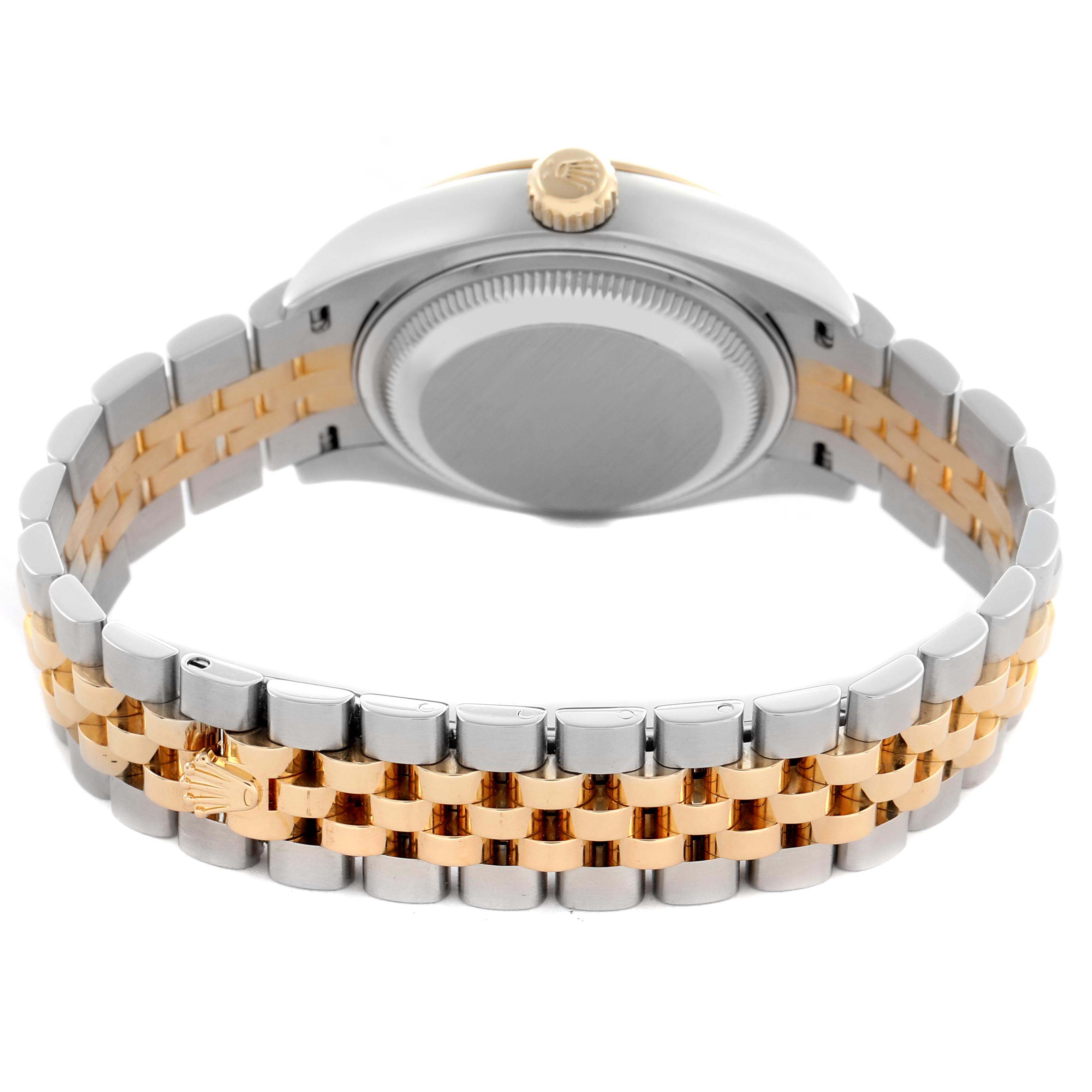 The image shows the backside of a Rolex Datejust 279173 Women's Steel and Gold (two tone) Champagne Dial 279173 Women's Steel and Gold (two tone) Champagne Dial watch with a gold and silver jubilee bracelet and visible crown.